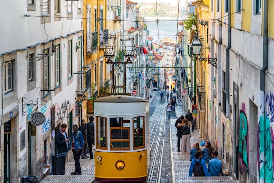 Street scene in Lisbon, Portugal. Photo contains incidental people and signage.