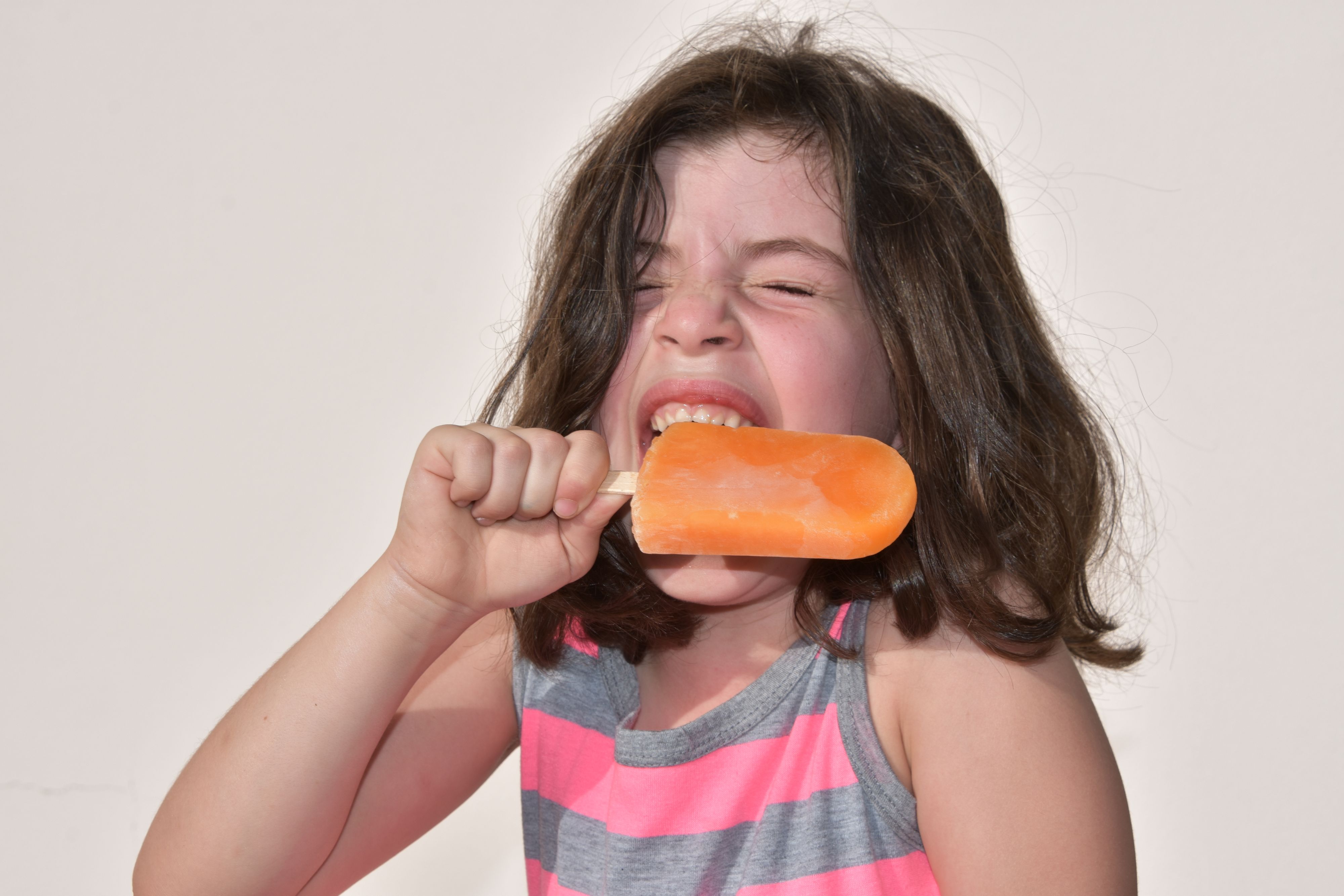 girl eating a popsicle