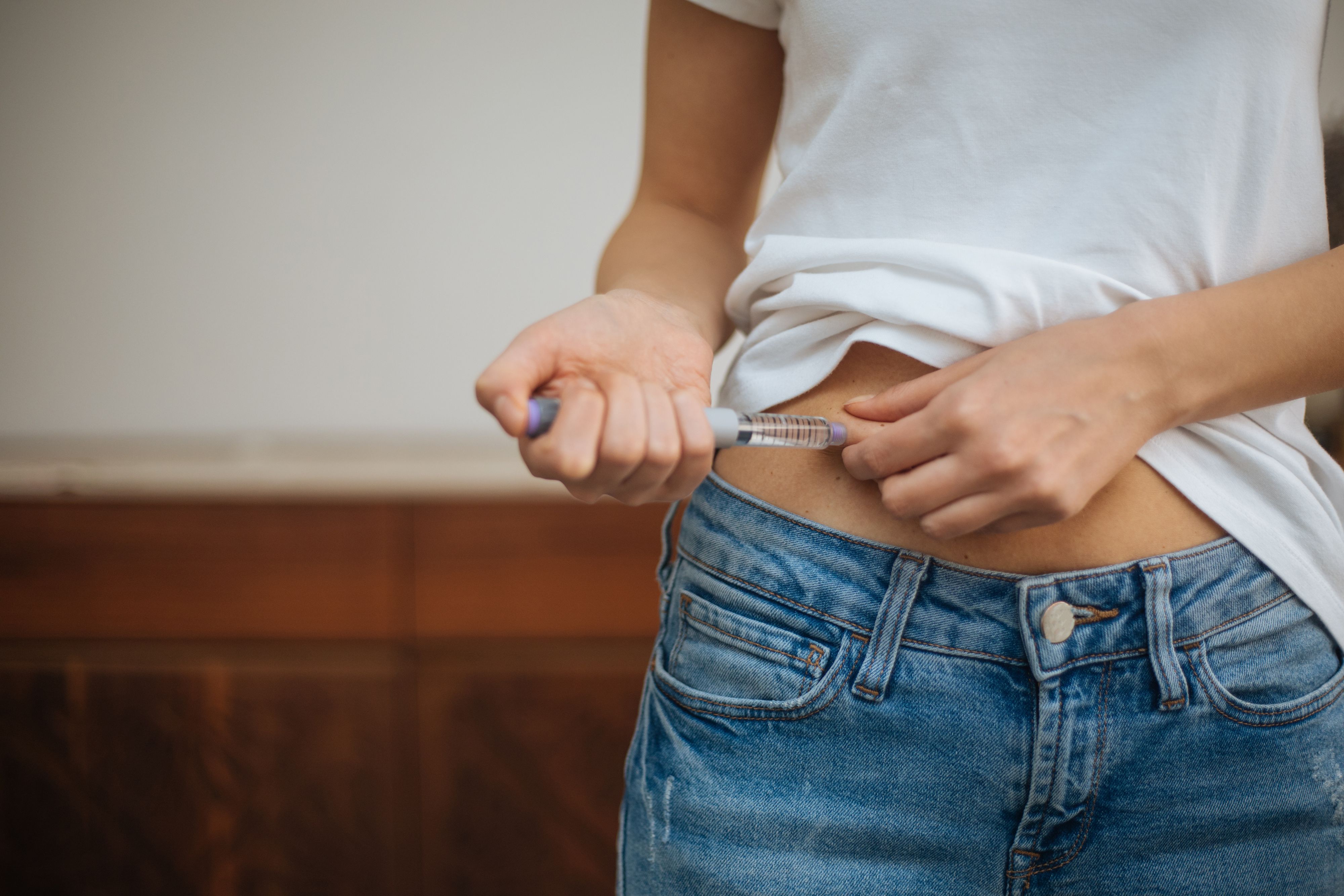 Woman doing insulin injection
