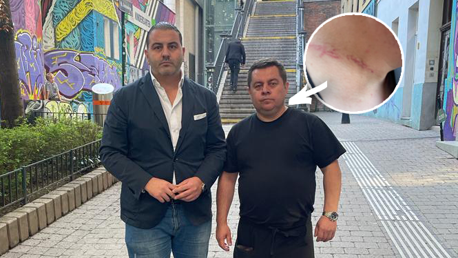 Der beraubte Wiener Wirt Damo Mada (Bild mit Leo Kohlbauer von der FPÖ) erlitt bei dem Überfall Abschürfungen am Hals.