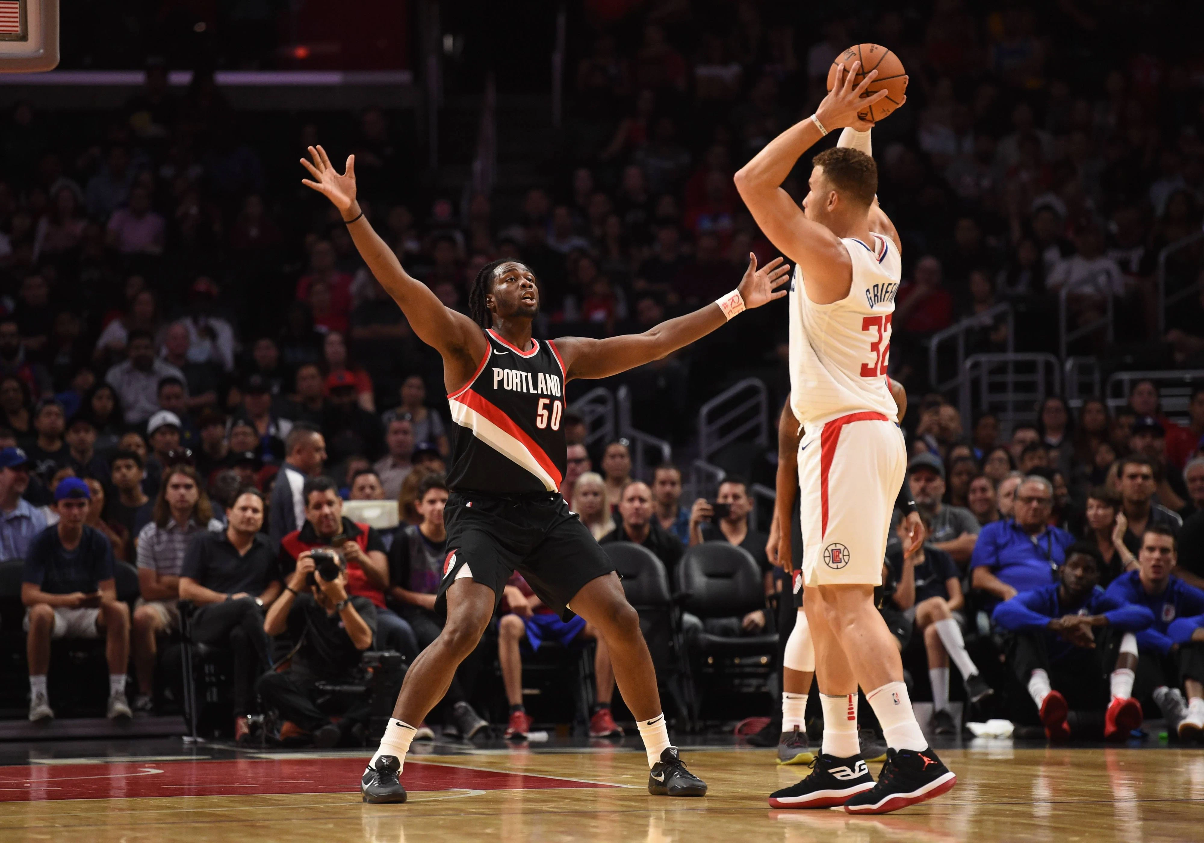 Caleb Swanigan (l.)