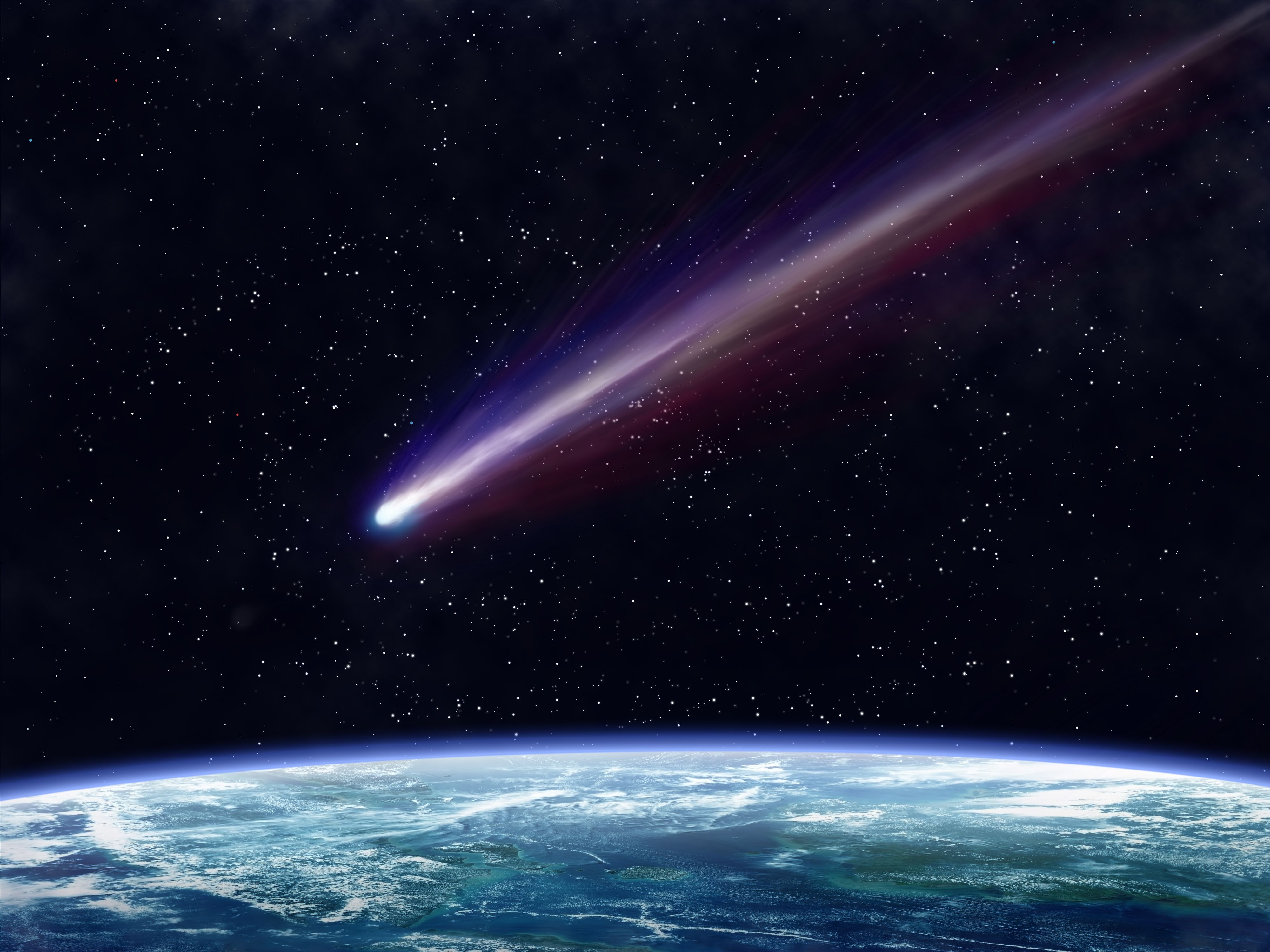 Illustration of a comet flying through space close to the earth