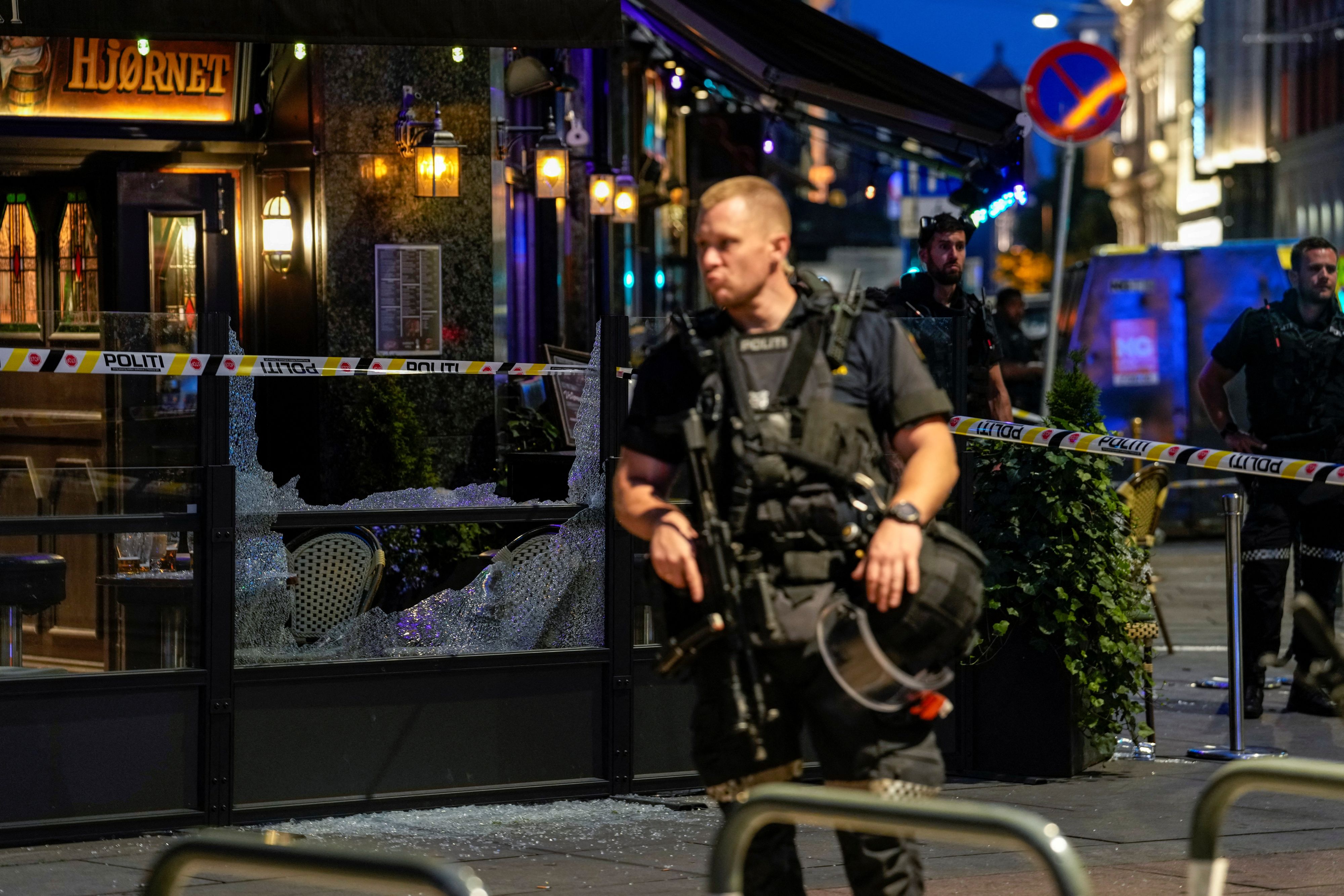 Security forces stand at the site where several people were injured during a shooting outside the London pub in central Oslo, Norway June 25, 2022. Javad Parsa/NTB/via REUTERS   ATTENTION EDITORS - THIS IMAGE WAS PROVIDED BY A THIRD PARTY. NORWAY OUT. NO COMMERCIAL OR EDITORIAL SALES IN NORWAY.