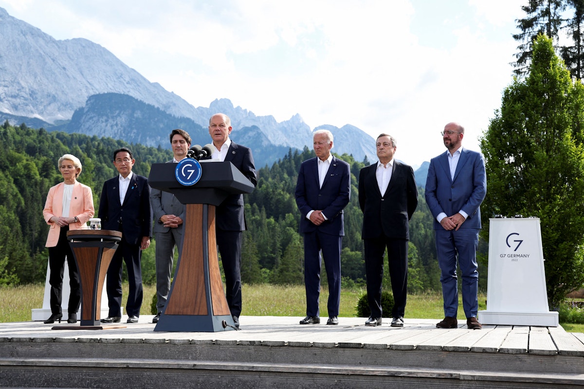 German Chancellor Olaf Scholz speaks next to European Commission President Ursula von der Leyen, Japanese Prime Minister Fumio Kishida, Canadian Prime Minister Justin Trudeau, U.S. President Joe Biden, Italian Prime Minister Mario Draghi and European Council President Charles Michel during the first day of the g7 leaders' summit at Bavaria's Schloss Elmau castle, near Garmisch-Partenkirchen, Germany, June 26, 2022. REUTERS/Lukas Barth