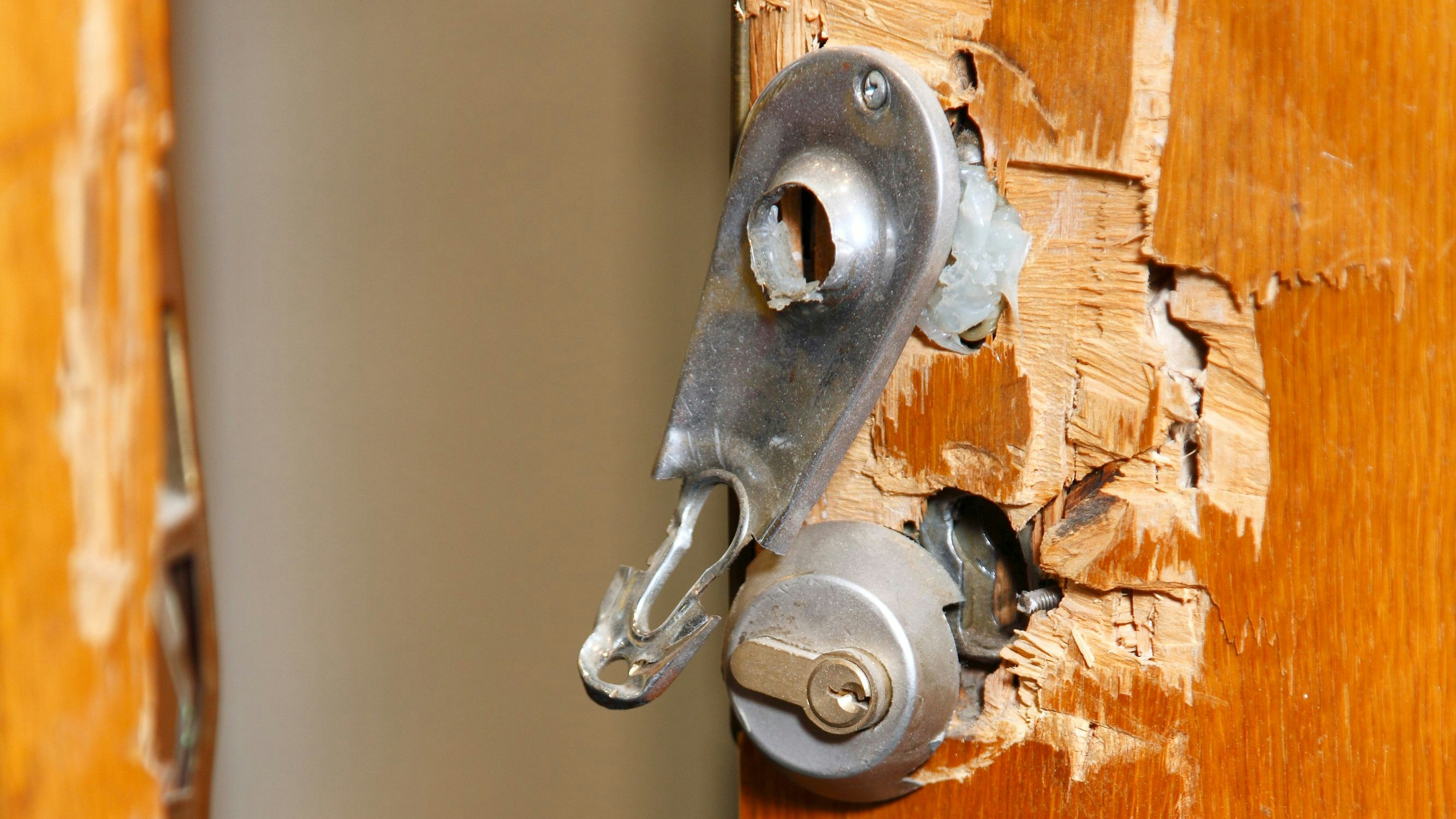 Broken lock and door frame damaged from break-in,open door
