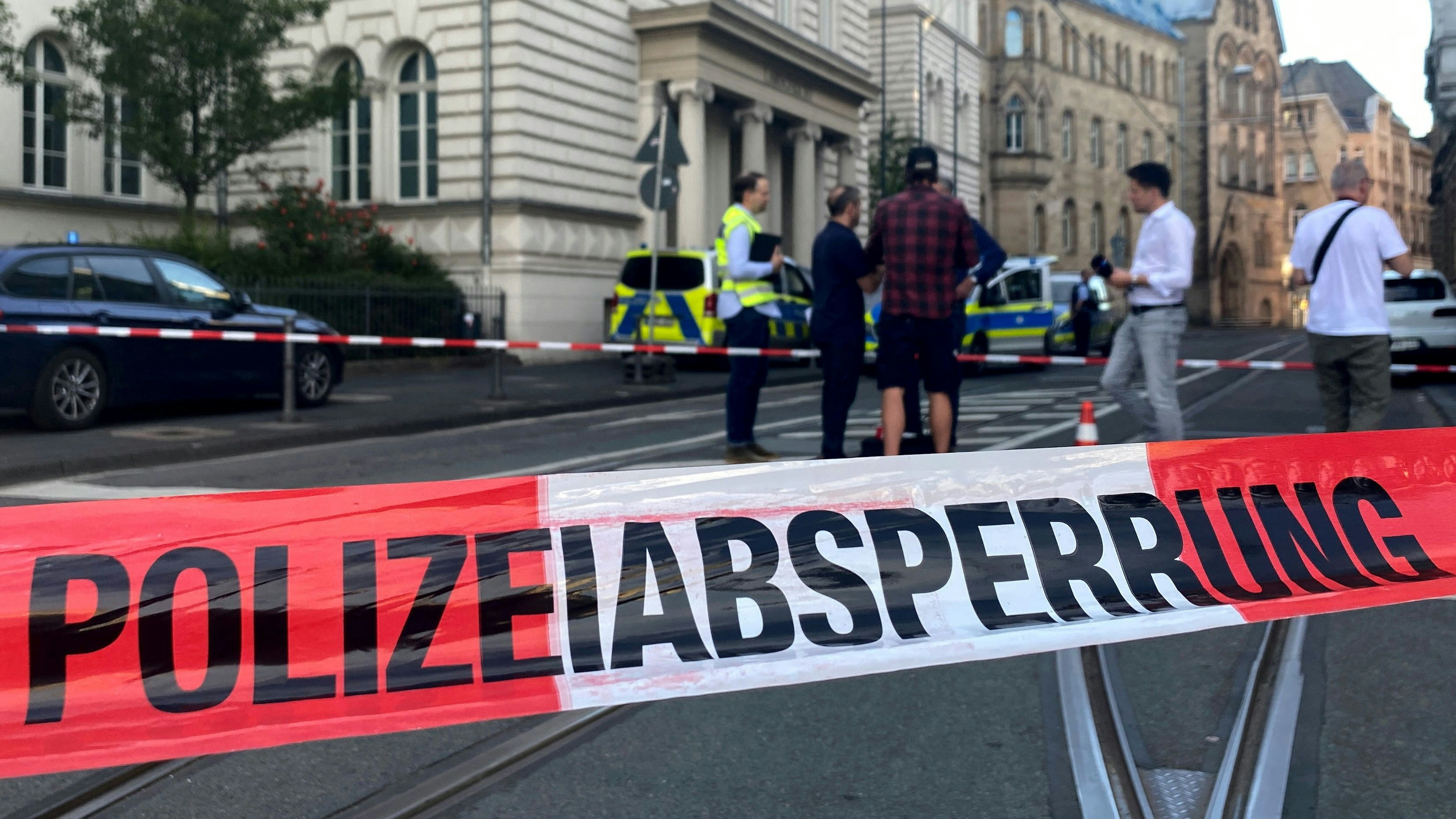Police secures the area around a district court after a man left a severed human head in front of the court building in Bonn, Germany, June 28, 2022. The police have arrested a man and a homicide commission will start an investigation, a newspaper said, adding that a body was found on the bank of the Rhine river in the city which police is examining its connection with the head.     REUTERS/Stephane Nitschke