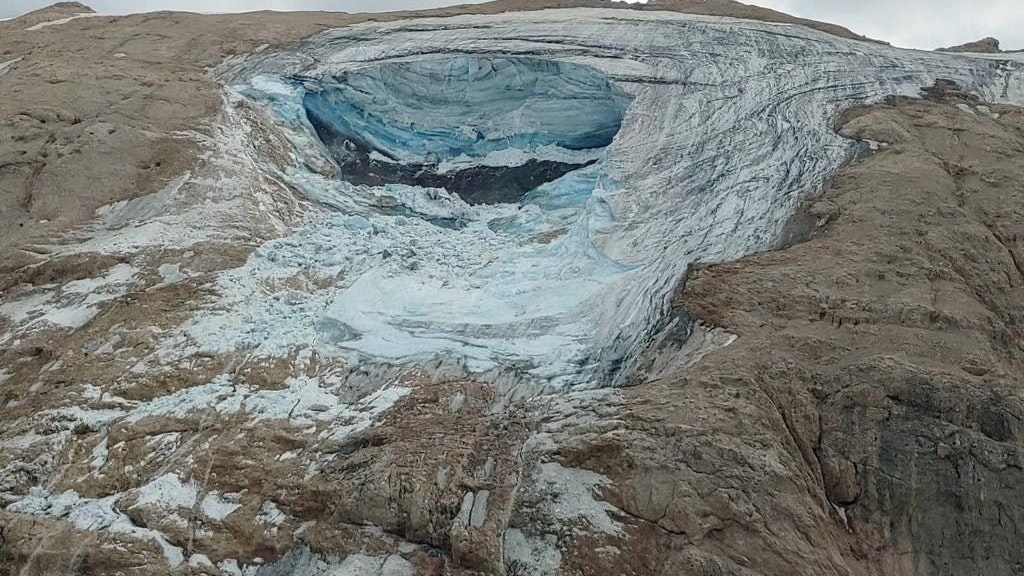 A handout photo from Alpine rescue services shows where an ice glacier collapsed on Marmolada mountain, Italy, July 3, 2022. Corpo Nazionale Soccorso Alpino e Speleologico/Handout via REUTERS ATTENTION EDITORS - THIS IMAGE HAS BEEN SUPPLIED BY A THIRD PARTY. DO NOT OBSCURE LOGO.