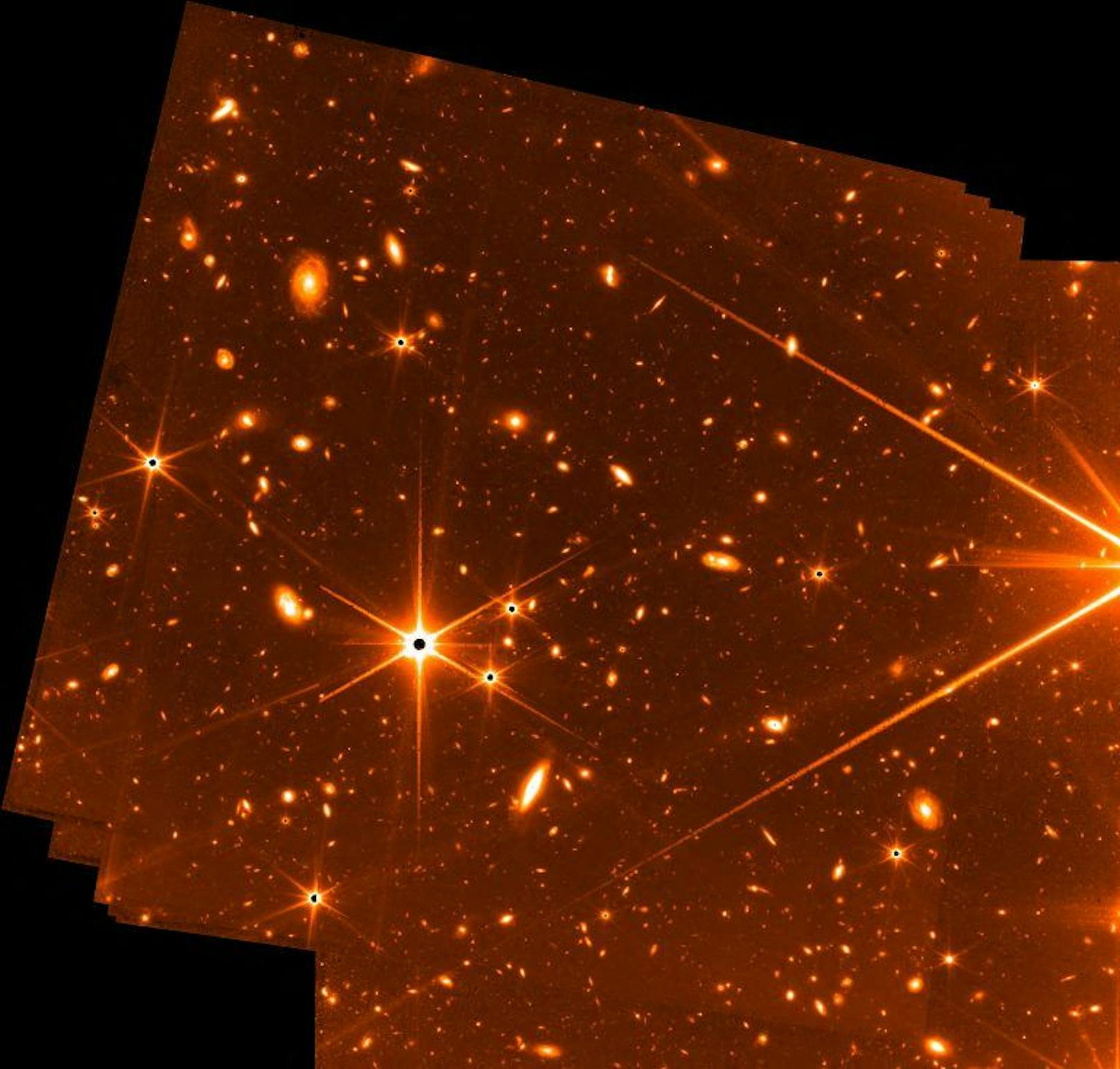 Lichtermeer in leuchtendem Orange: Die Vorschau der NASA zeigt den Ausschnitt eines Bildes, auf dem Sterne und Galaxien zu sehen sind, entstanden mit 72 Aufnahmen in einem Zeitraum von 32 Stunden. "Eine der tiefgehendsten Aufnahmen, die je vom Universum gemacht wurden".