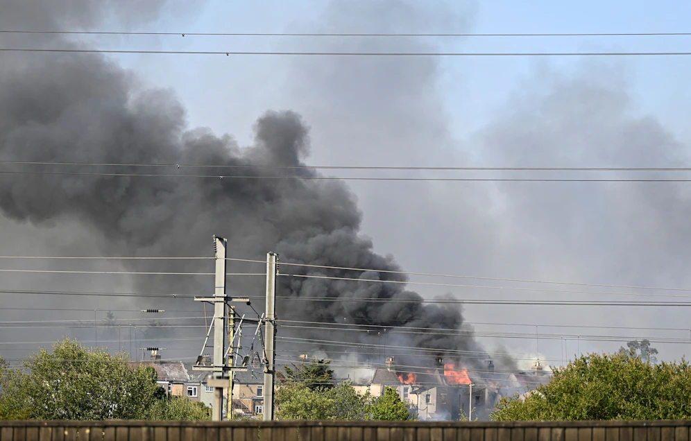A fire burns during a heatwave, in Rainham, east London, Britain, July 19, 2022. REUTERS/Tony O'Brien  