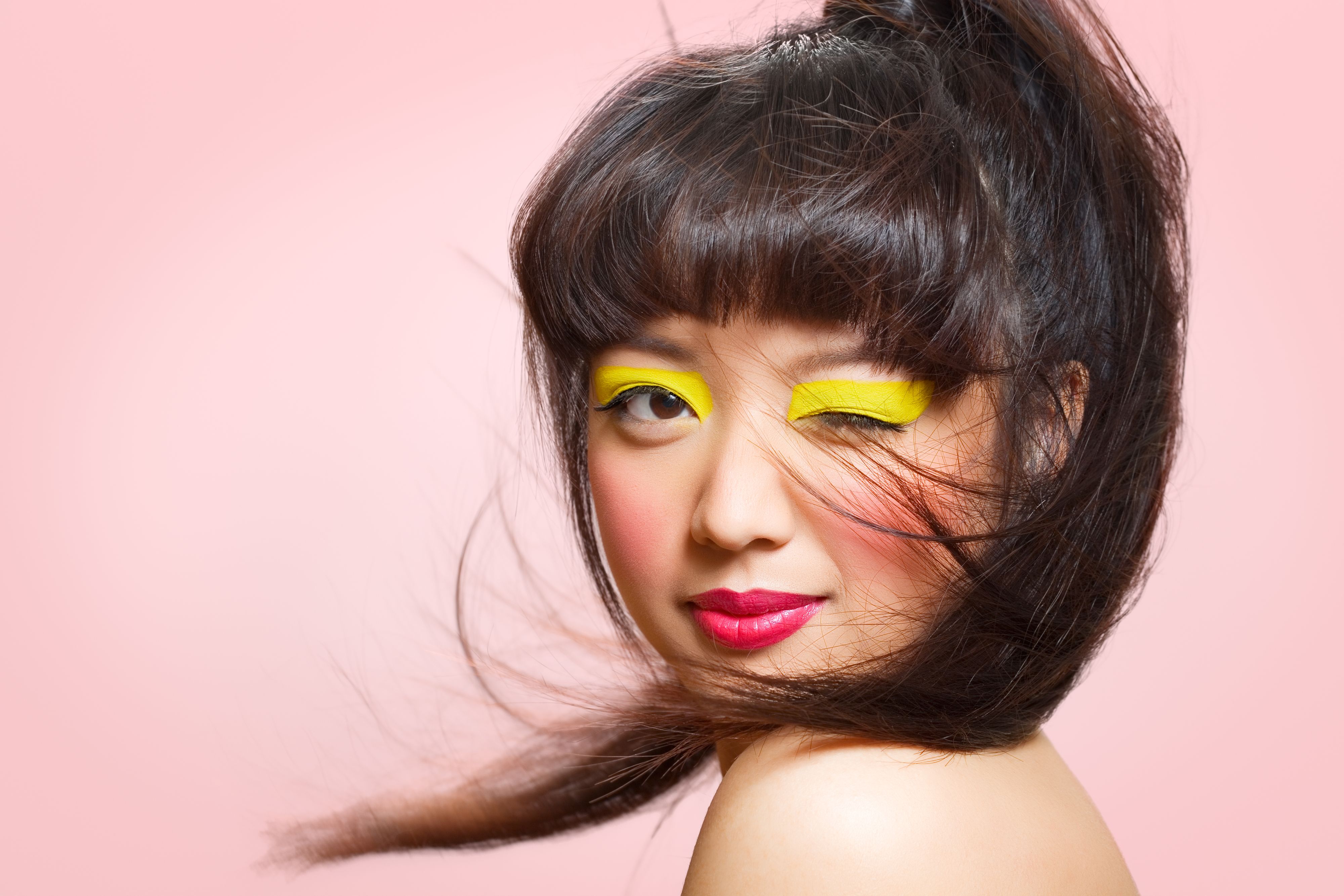 Asian model with colorful makeup.
