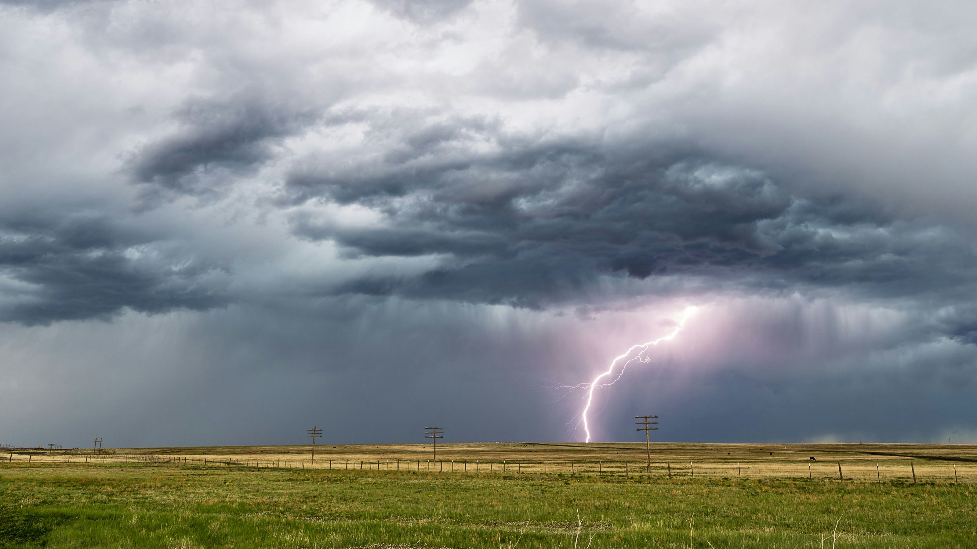Stormy sky with lightning and dark clouds.