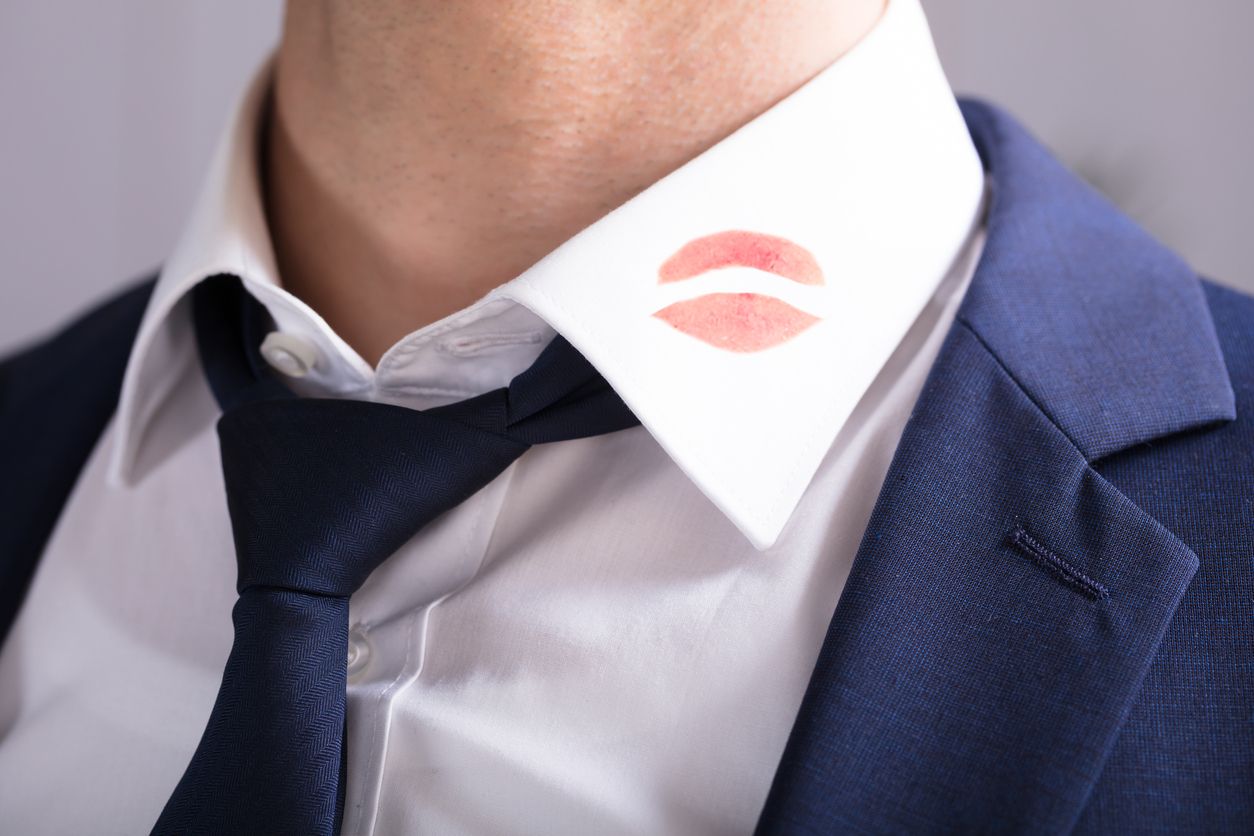 Close-up Of A Businessman With Lipstick Kiss Marks On Shirt's Collar