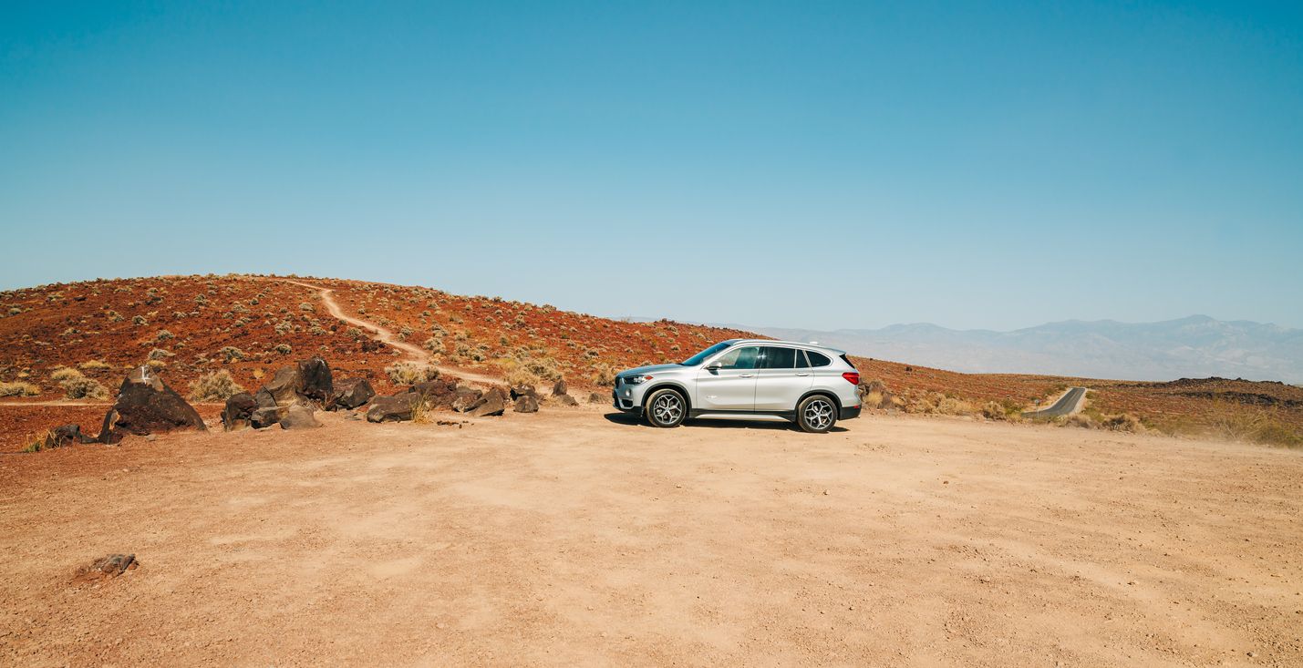 Car in desert. Padre Crowley Point at 4000 feet in Death Valley National Park.  Death Valley, California, USA- April 13, 2021