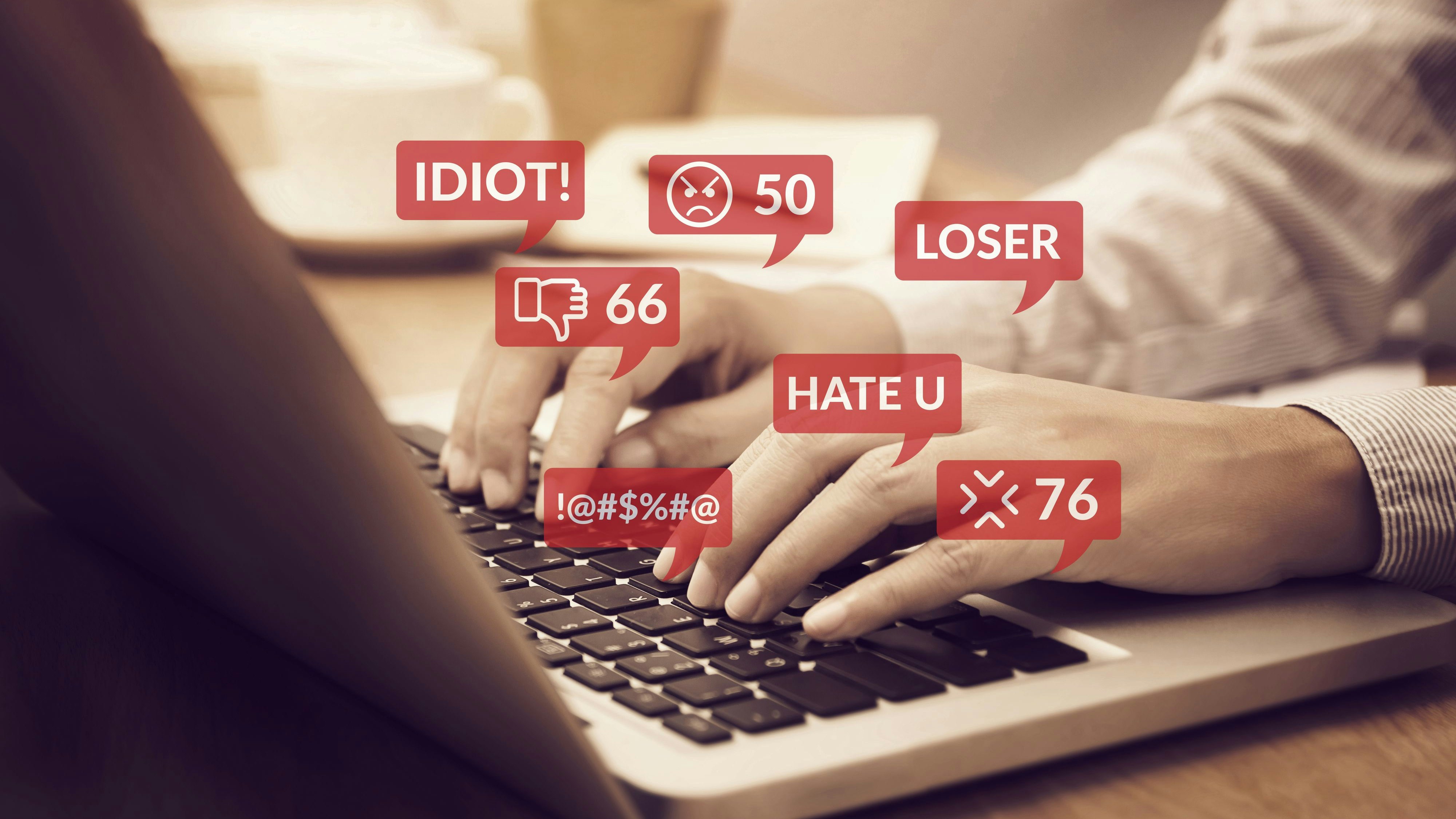 cyber bullying concept. people using notebook computer laptop for social media interactions with notification icons of hate speech and mean comment in social network