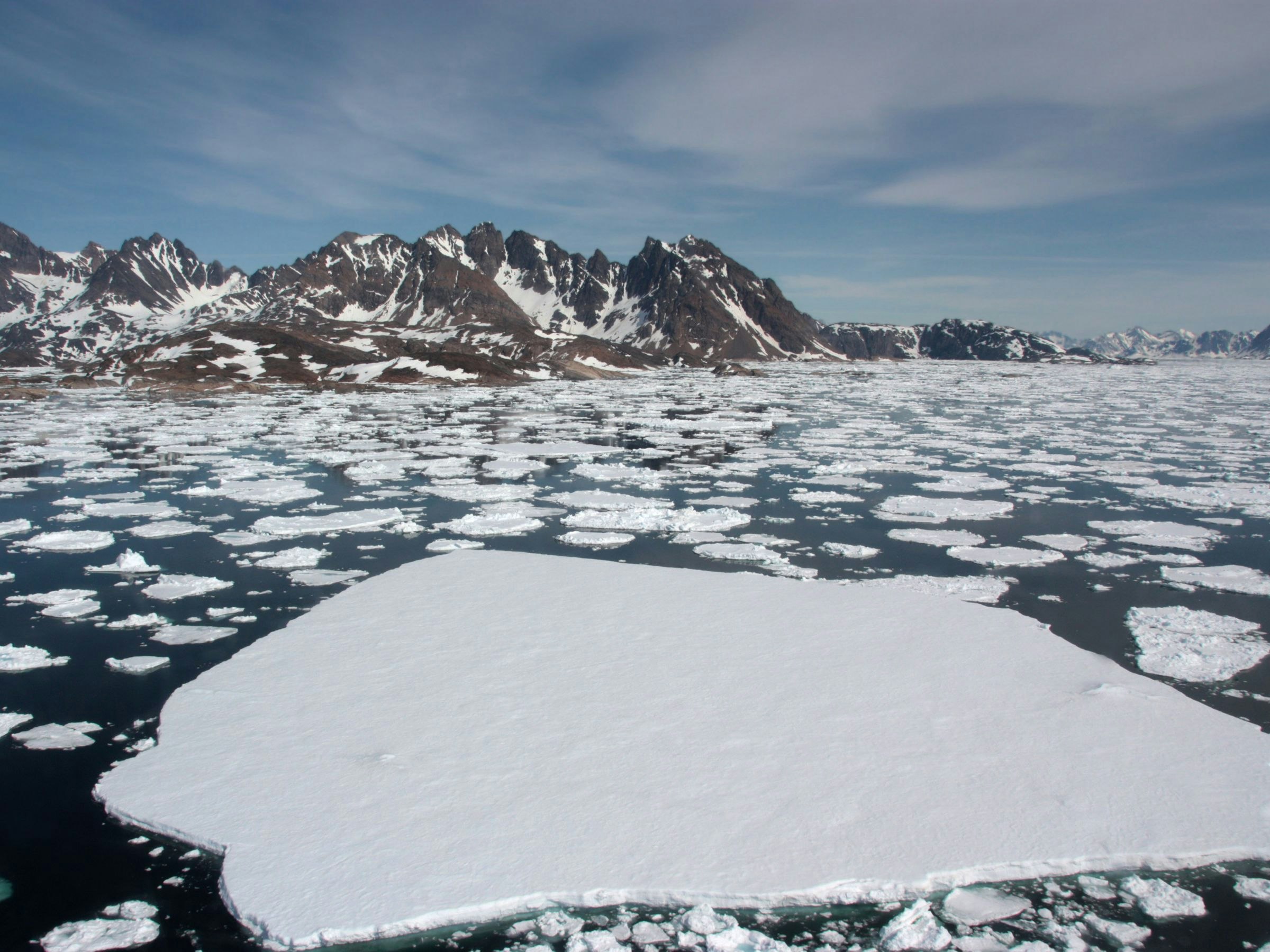 Sea ice breaking up in spring. Near Kulusuk, Greenland.