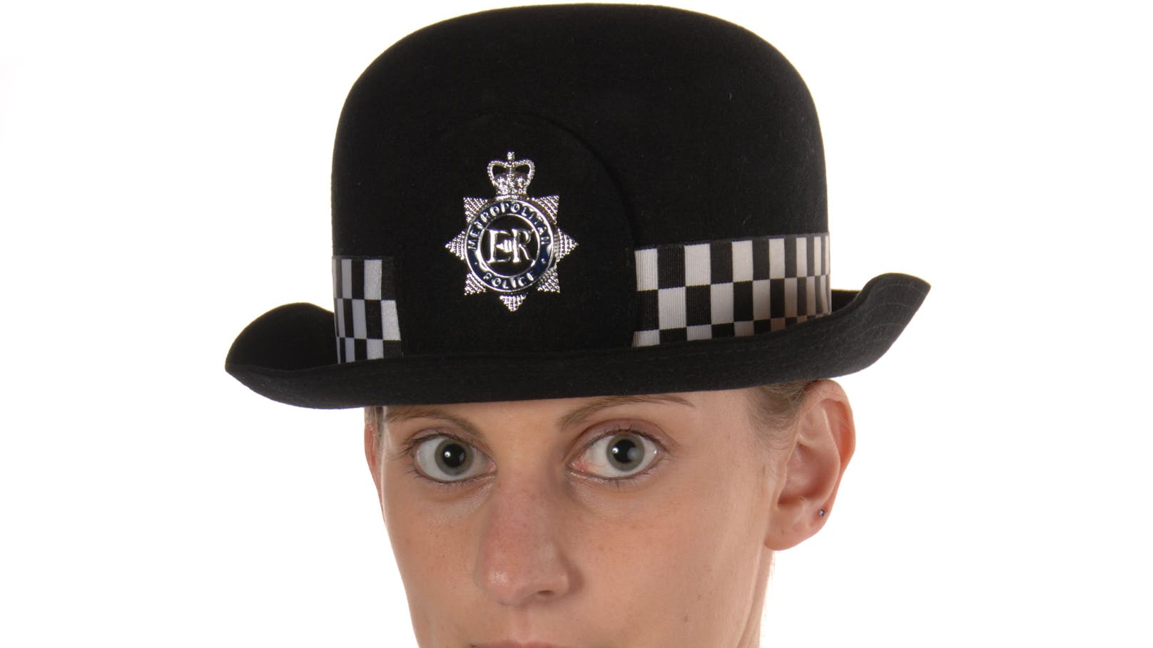 Uniformed UK female police officer looking to the front isolated on white