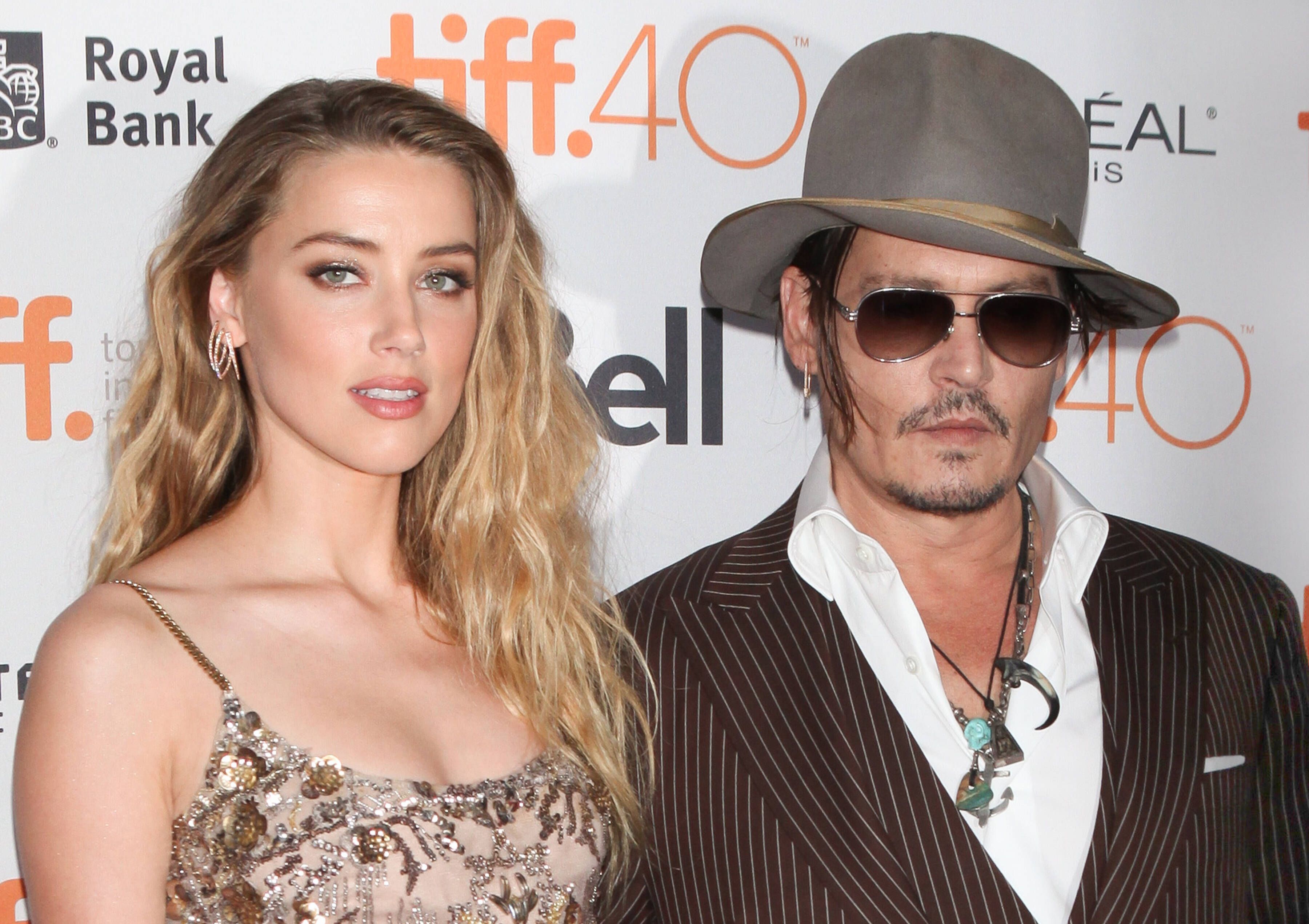 **FILE PHOTO** Johnny Depp Wins Defamation Trial Against Amber Heard. ***FILE PHOTO*** Amber Heard Admits To Hitting Johnny Depp In Leaked Audio. Toronto, Canada - September 12: Amber Heard and Johnny Depp attend the The Danish Girl Premiere at the 2015 Toronto International Film Festival on September 12, 2015 in Toronto, Canada. PUBLICATIONxNOTxINxUSA Copyright: xDiegoxCorredor/MediaPunchx 