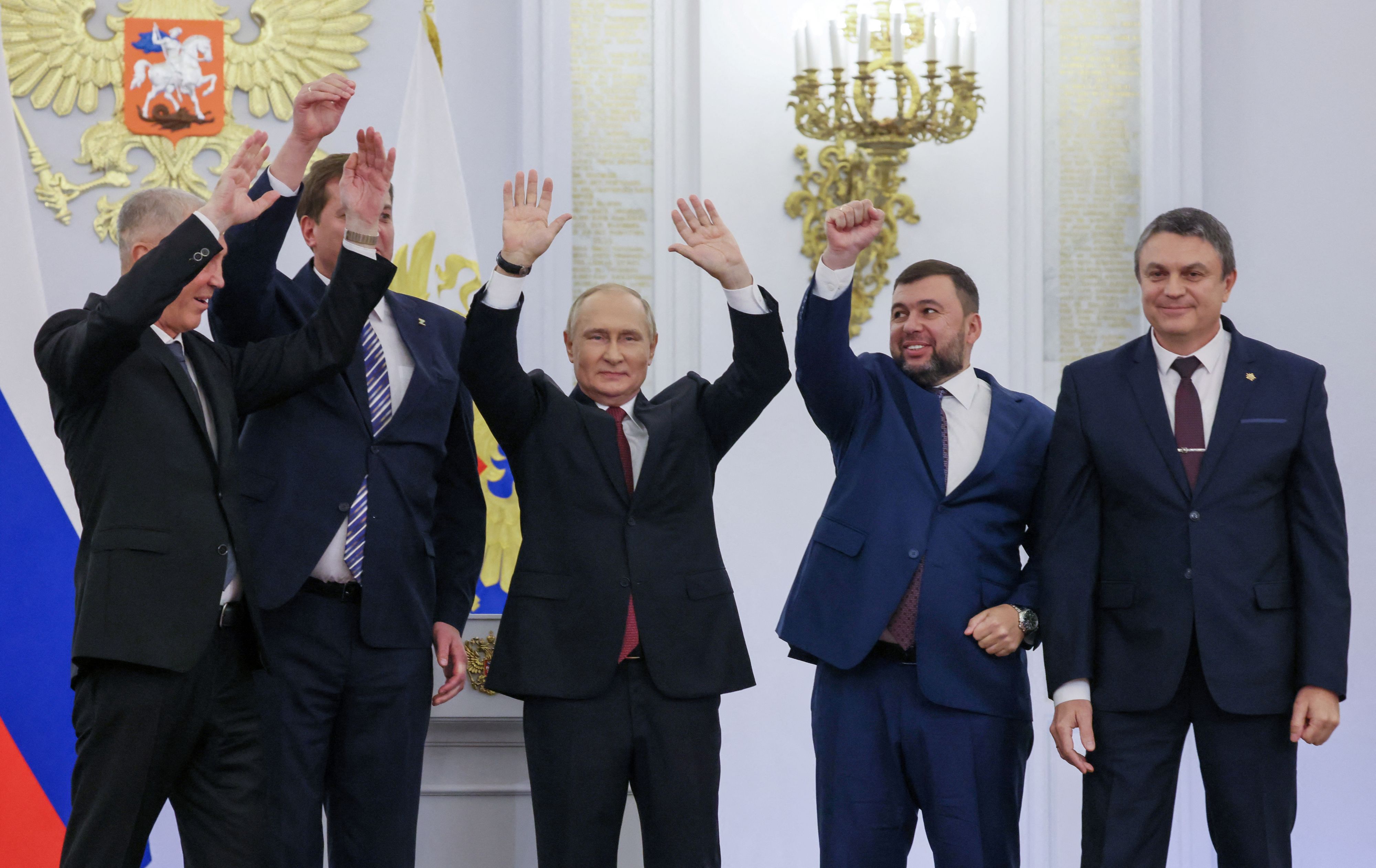 Russian President Vladimir Putin and Denis Pushilin, Leonid Pasechnik, Vladimir Saldo, Yevgeny Balitsky, who are the Russian-installed leaders in Ukraine's Donetsk, Luhansk, Kherson and Zaporizhzhia regions, attend a ceremony to declare the annexation of the Russian-controlled territories of four Ukraine's Donetsk, Luhansk, Kherson and Zaporizhzhia regions, after holding what Russian authorities called referendums in the occupied areas of Ukraine that were condemned by Kyiv and governments worldwide, in the Georgievsky Hall of the Great Kremlin Palace in Moscow, Russia, September 30, 2022. Sputnik/Mikhail Metzel/Pool via REUTERS ATTENTION EDITORS - THIS IMAGE WAS PROVIDED BY A THIRD PARTY.