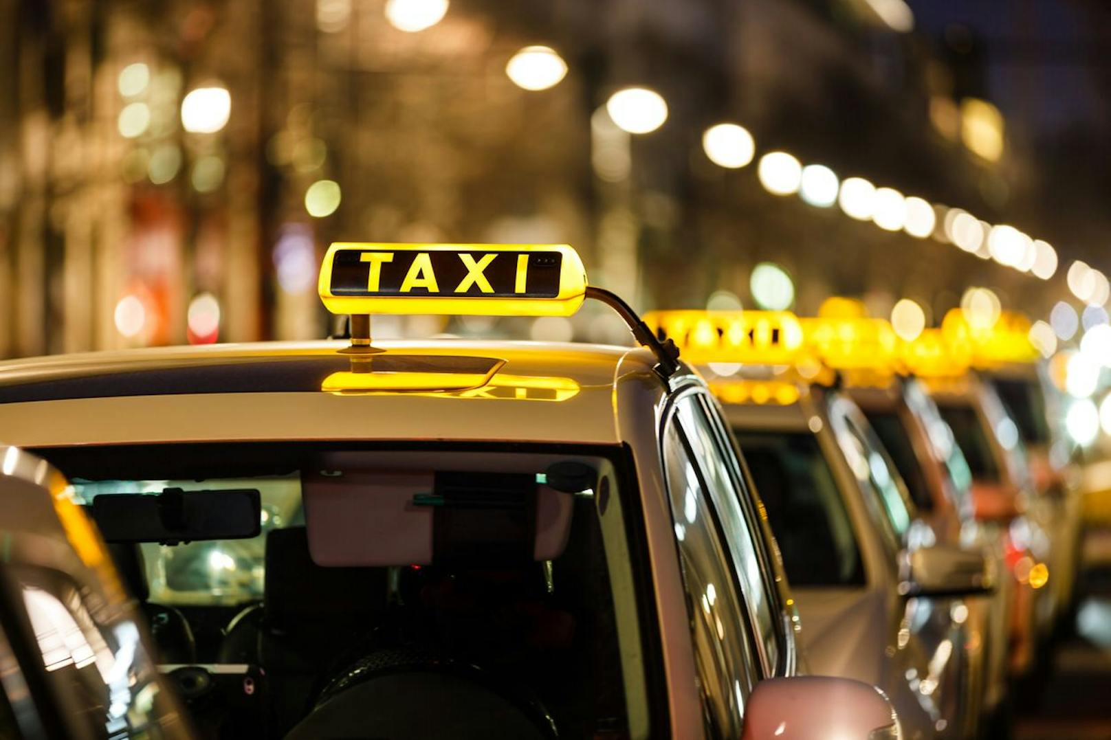 Taxis waiting in a row.