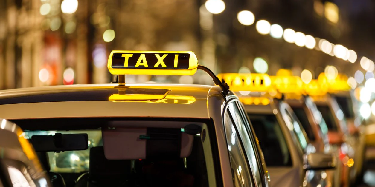 Taxis waiting in a row.