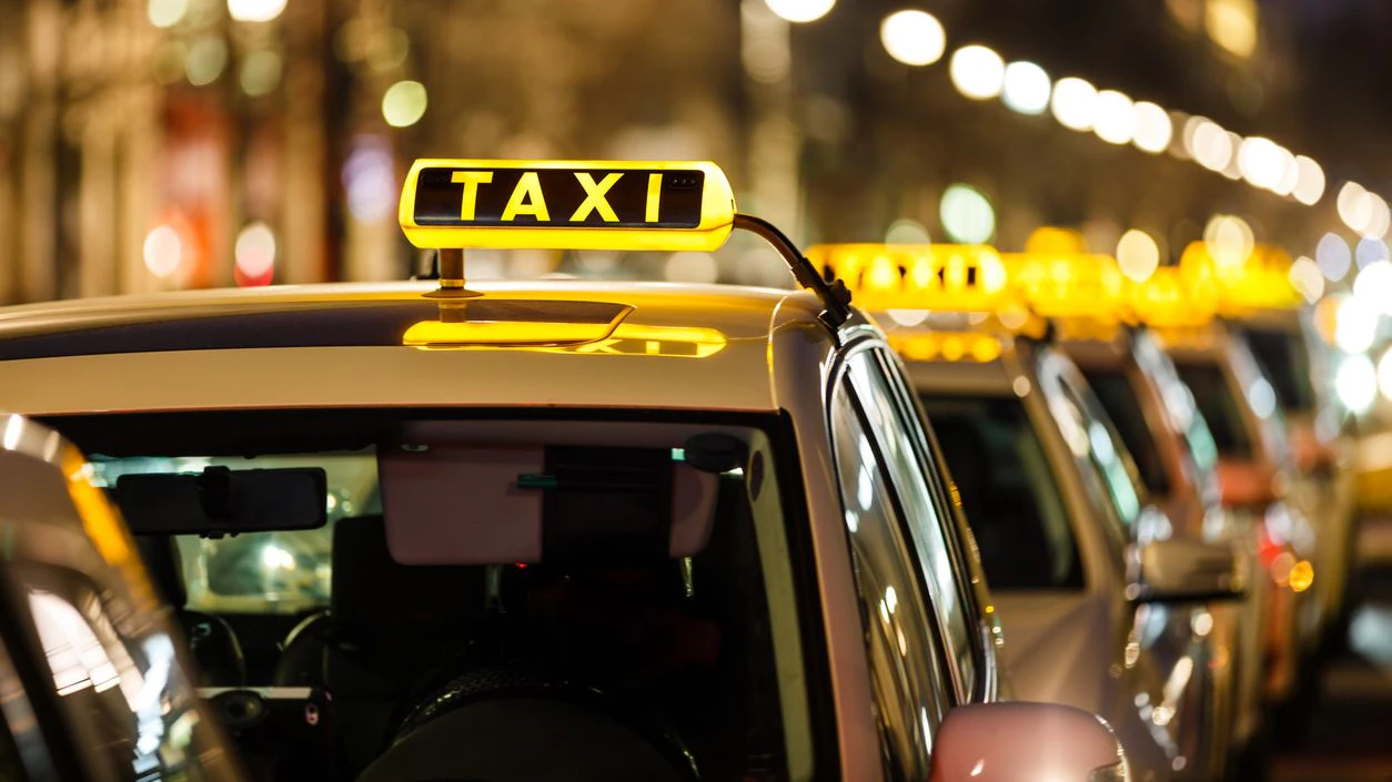 Taxis waiting in a row.