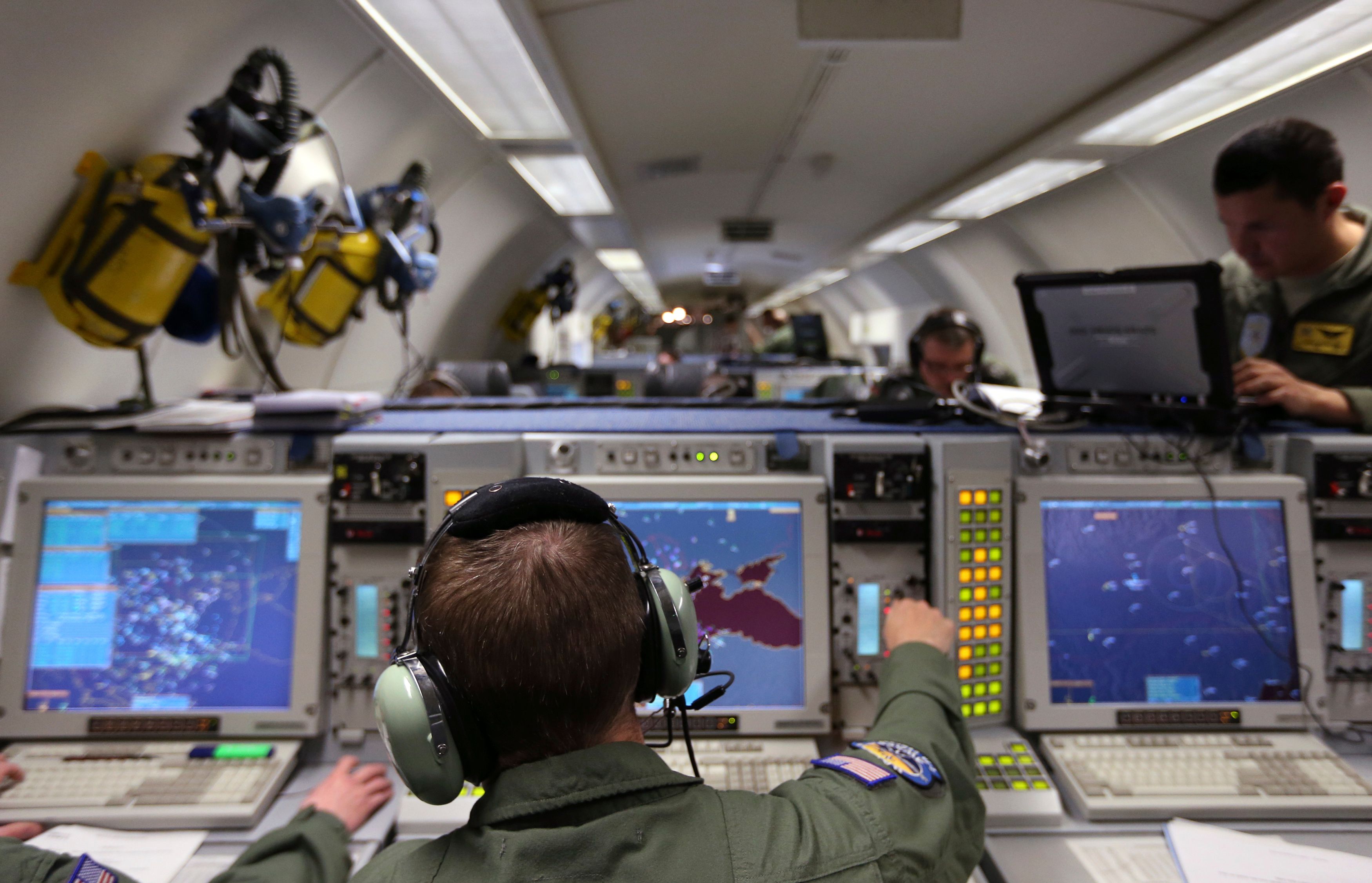 A controller monitors screens aboard a NATO AWACS (Airborne Warning and Control Systems) aircraft during a surveillance flight over Romania, from the AWACS air base in Geilenkirchen near the German-Dutch border April 16, 2014. NATO said on Wednesday it would send more ships, planes and troops to eastern Europe to reassure allies worried by Russia's annexation of Crimea but shied away from new permanent bases in the east as Poland wanted.  REUTERS/Francois Lenoir (ROMANIA  - Tags: POLITICS MILITARY)