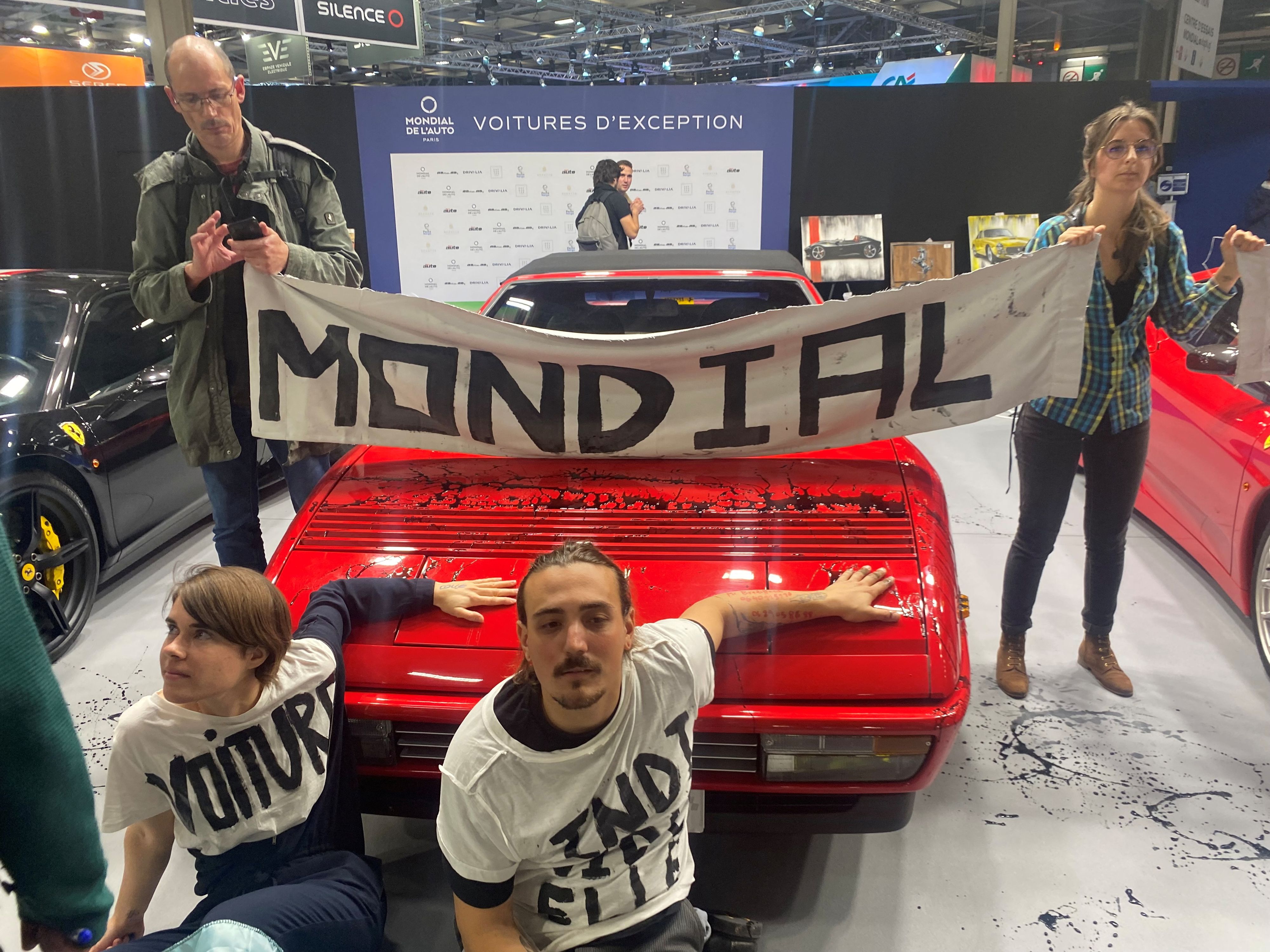 People protest during an autoshow, in Paris, France, October 21, 2022, in this still frame. Extinction Rebellion France /via REUTERS THIS IMAGE HAS BEEN SUPPLIED BY A THIRD PARTY. MANDATORY CREDIT. 