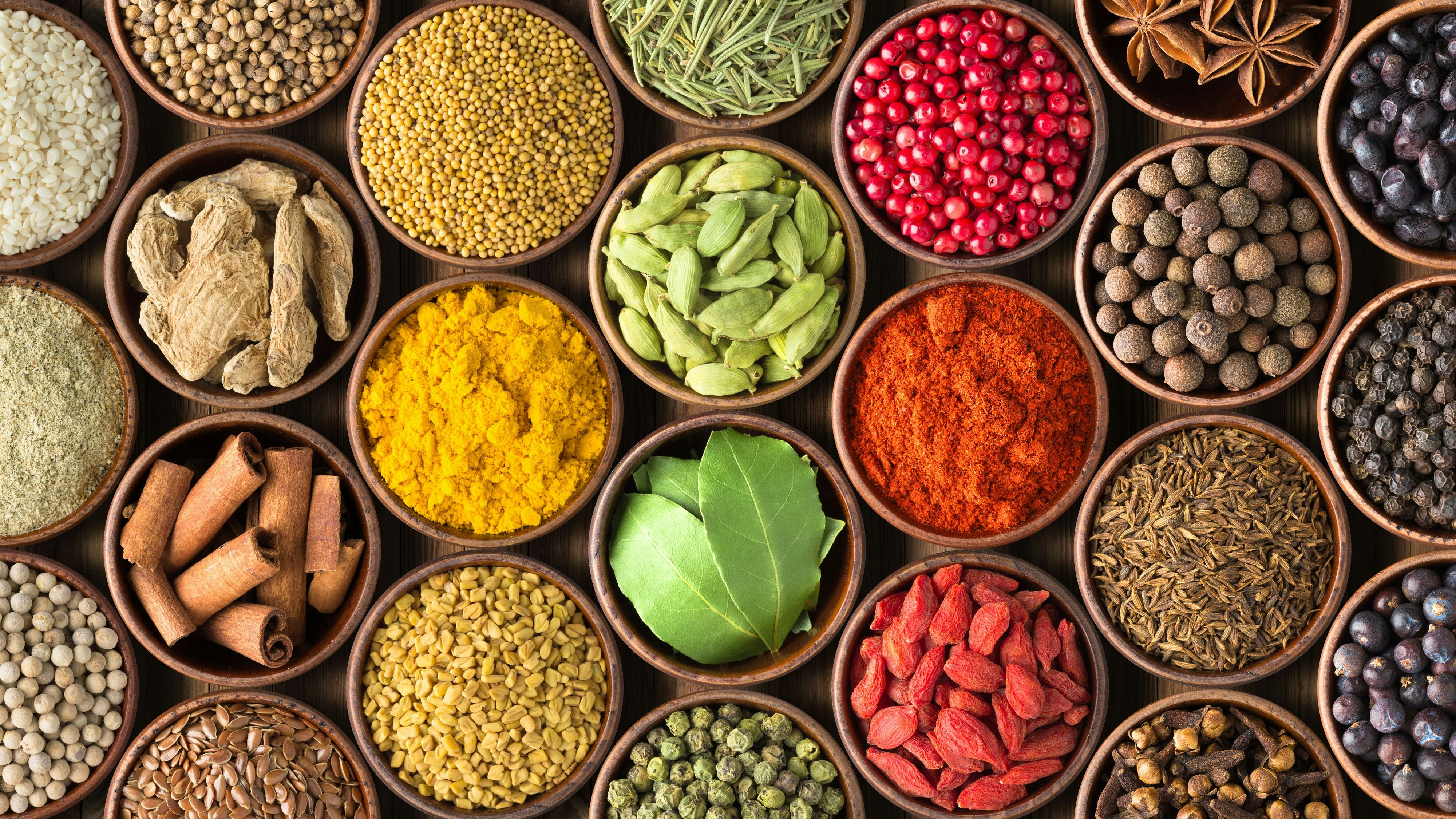 Colored spice background. Spices and herbs top view