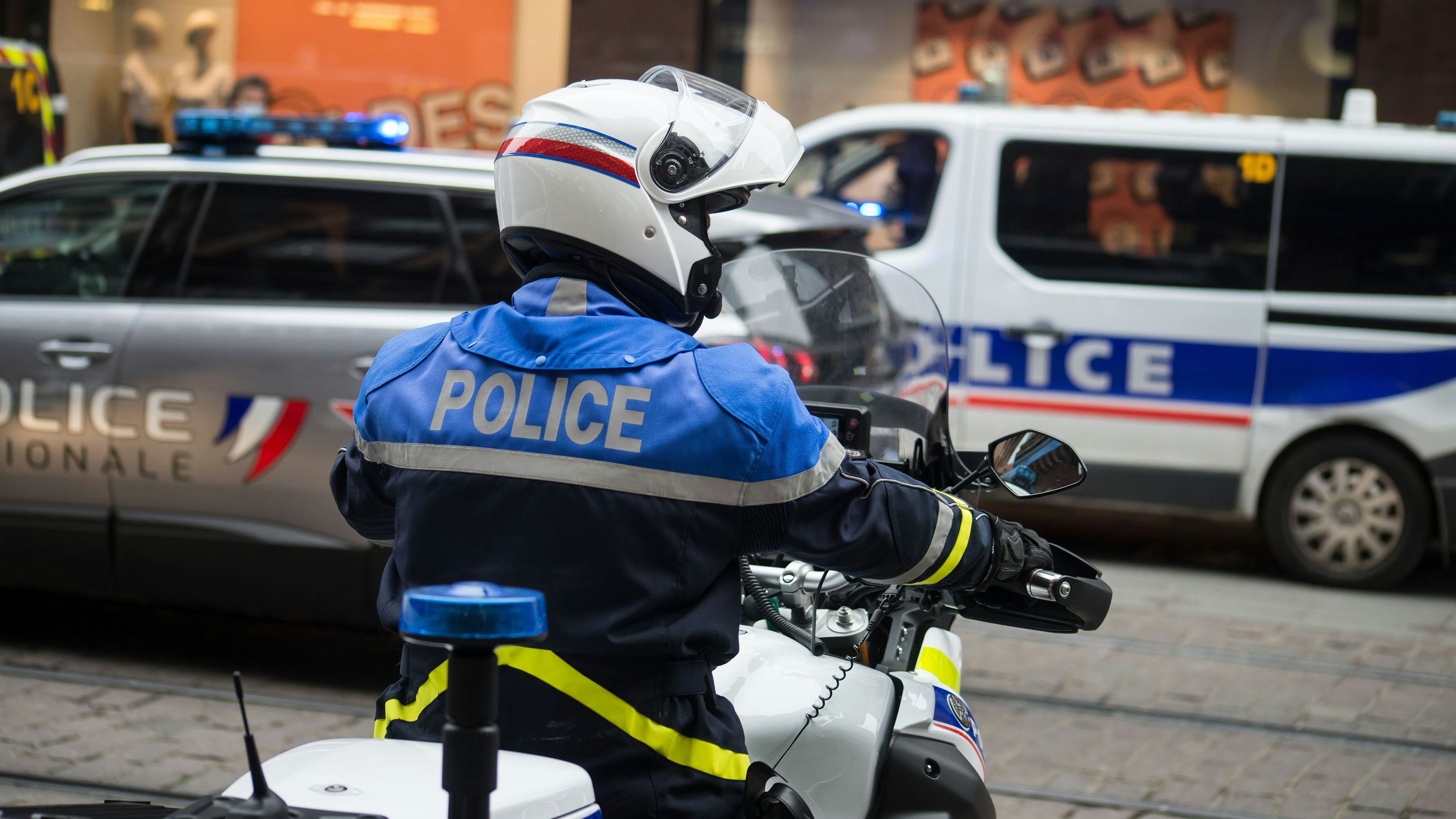 Strasbourg - France - 29 January 2022 - Portrait of french national policeman and motorbike in the street