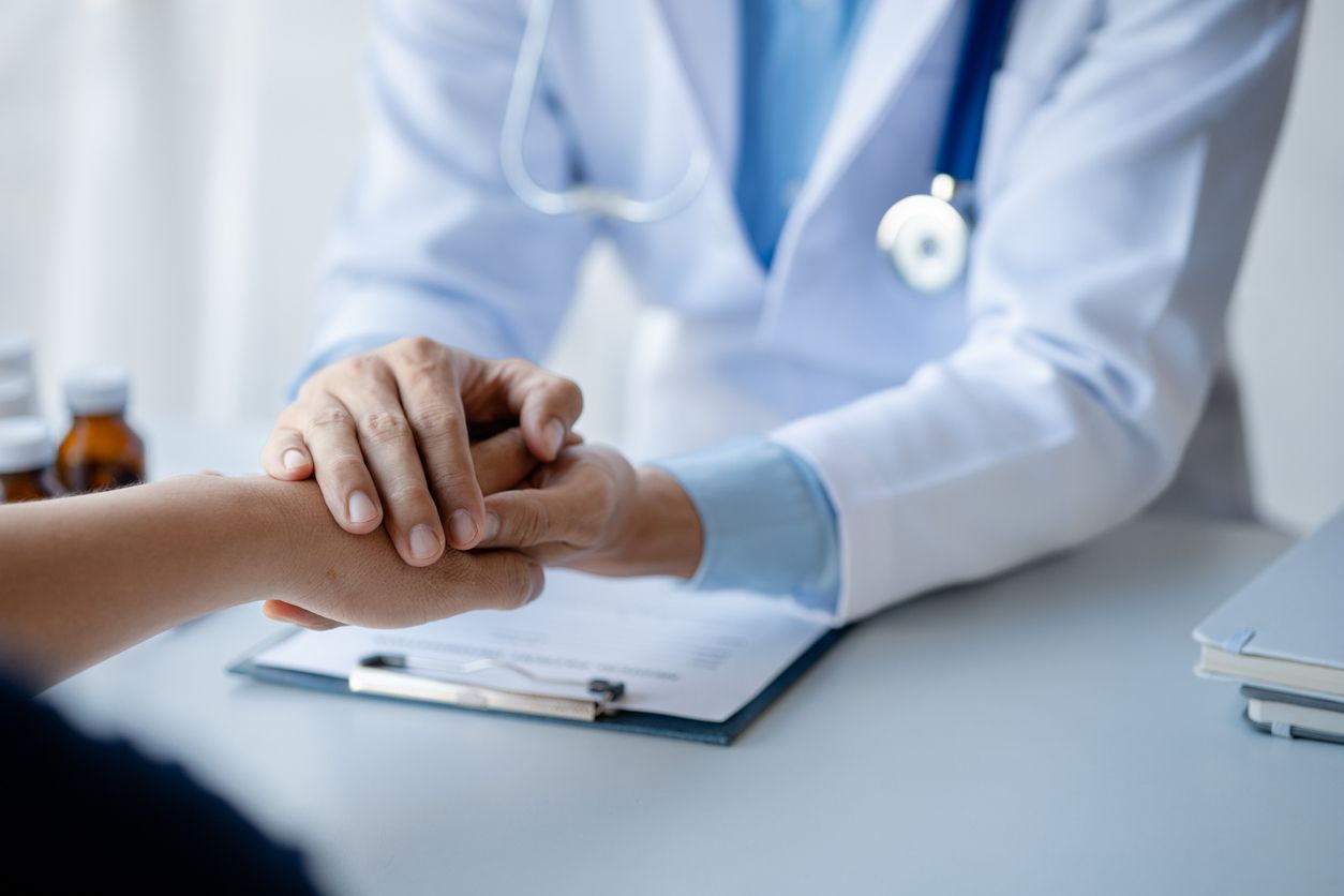 Doctor shook hands to encourage the patient after informing the results of the examination and informing the patients about treatment guidelines and prescribing medicines. Disease examination concept.