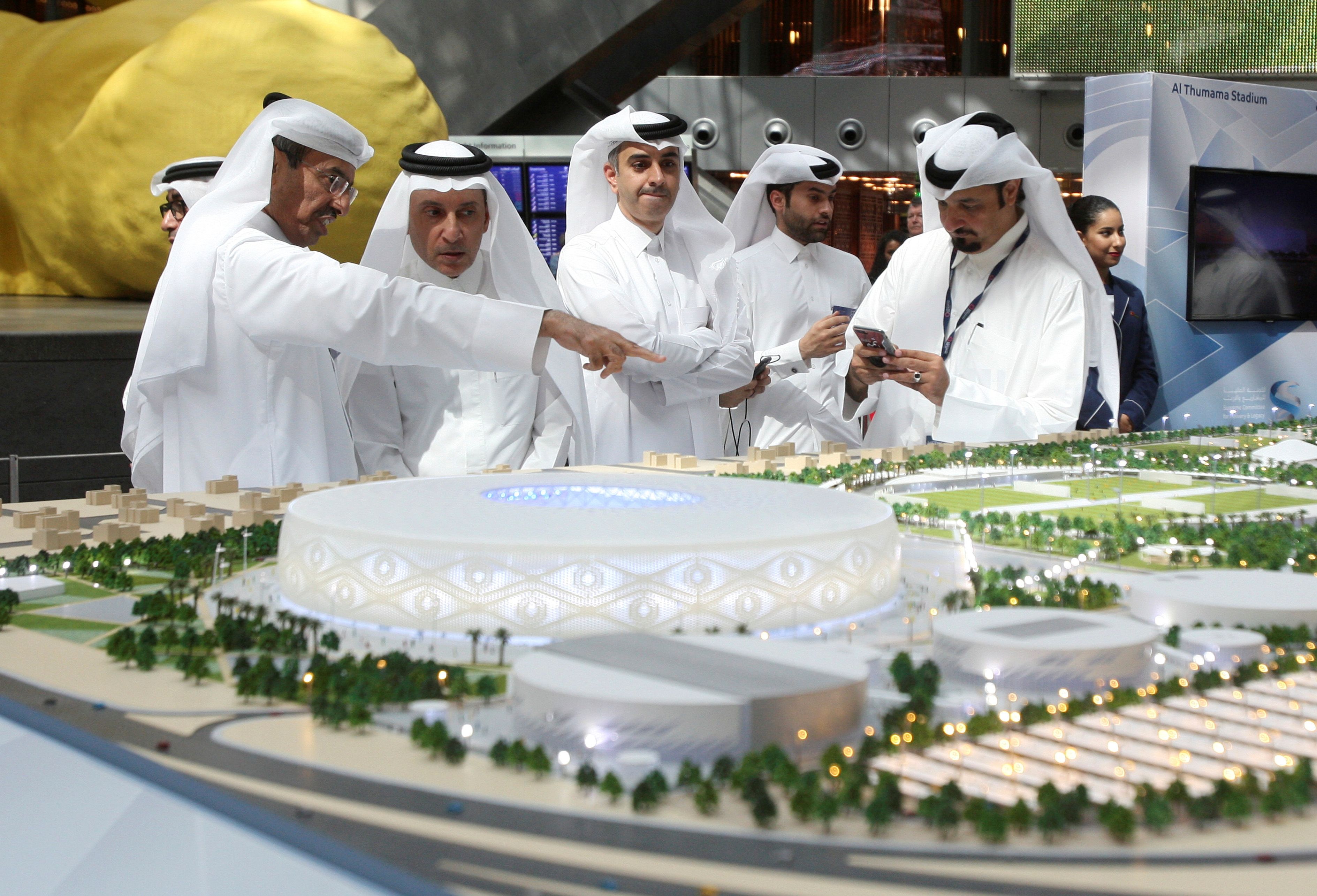Qatar Airways Chief Executive Akbar al-Baker looks at a model of Al Thumama stadium during an unveiling ceremony at Hamad International Airport in Doha, Qatar, August 24, 2017. REUTERS/Naseem Zeitoon