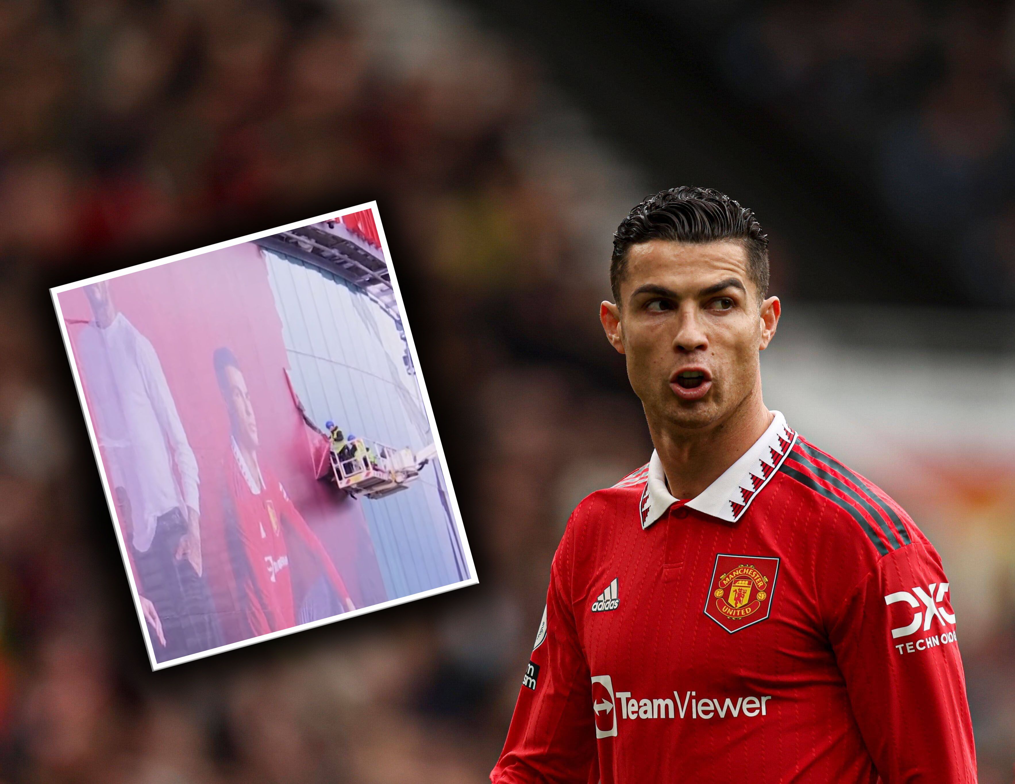 Arbeiter entfernen Cristiano Ronaldo von der Fassade des Stadions.