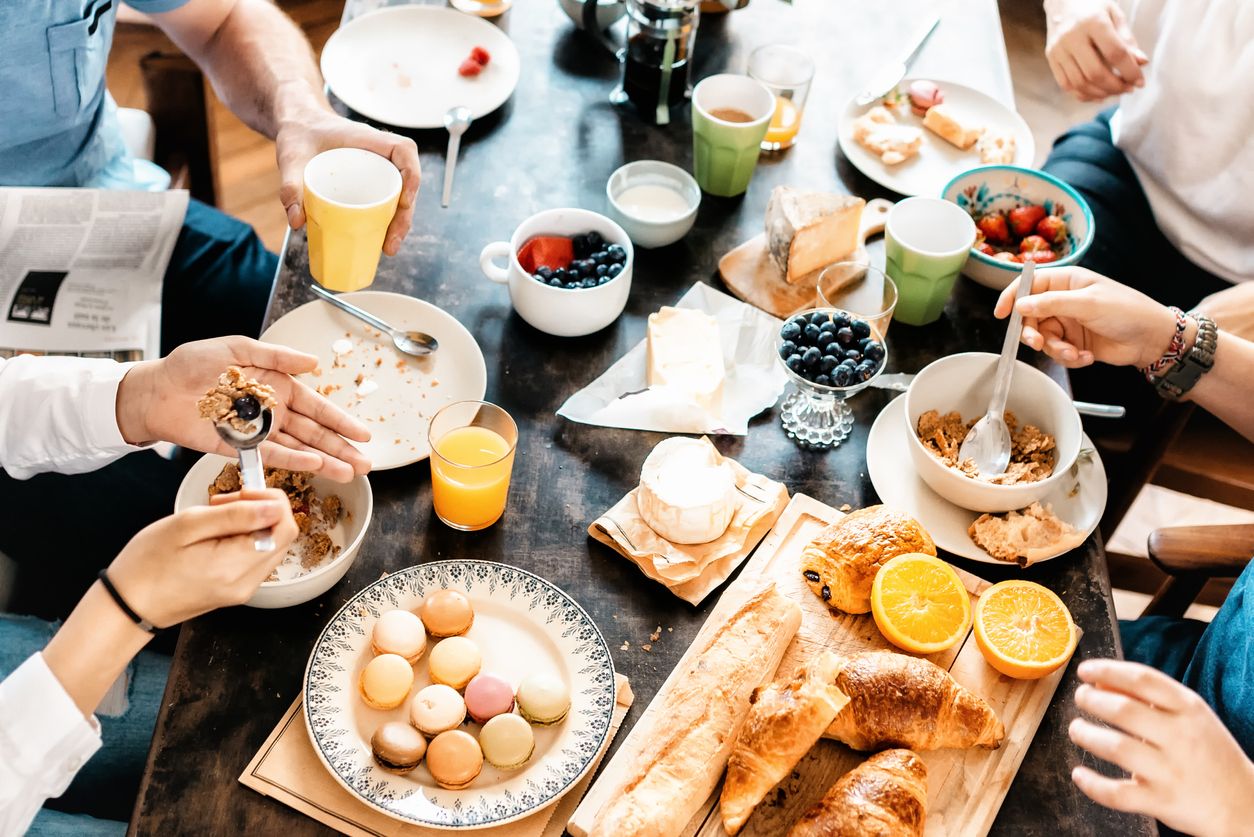 family having breakfast together at weekend