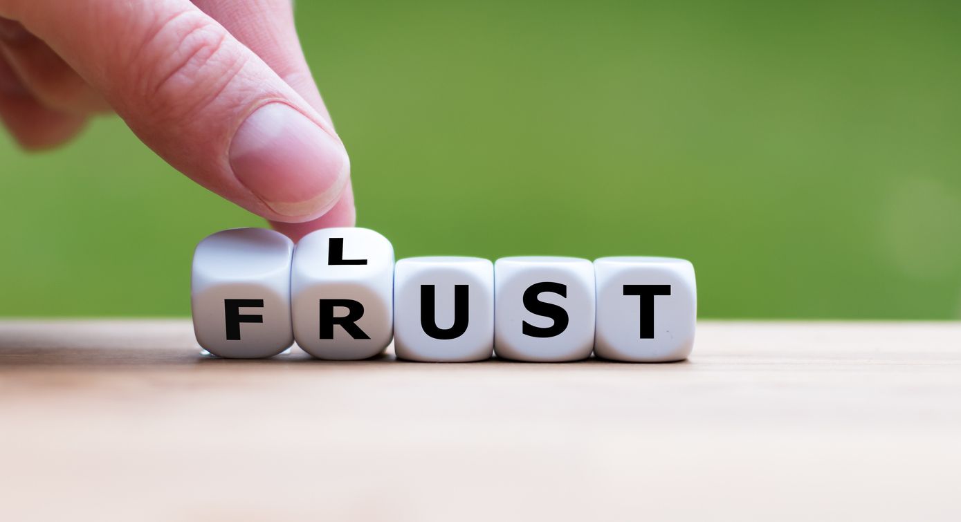 Hand is turning dices and changes the german word "Frust" to "Lust". Which is a symbol for having lust instead of frustration.