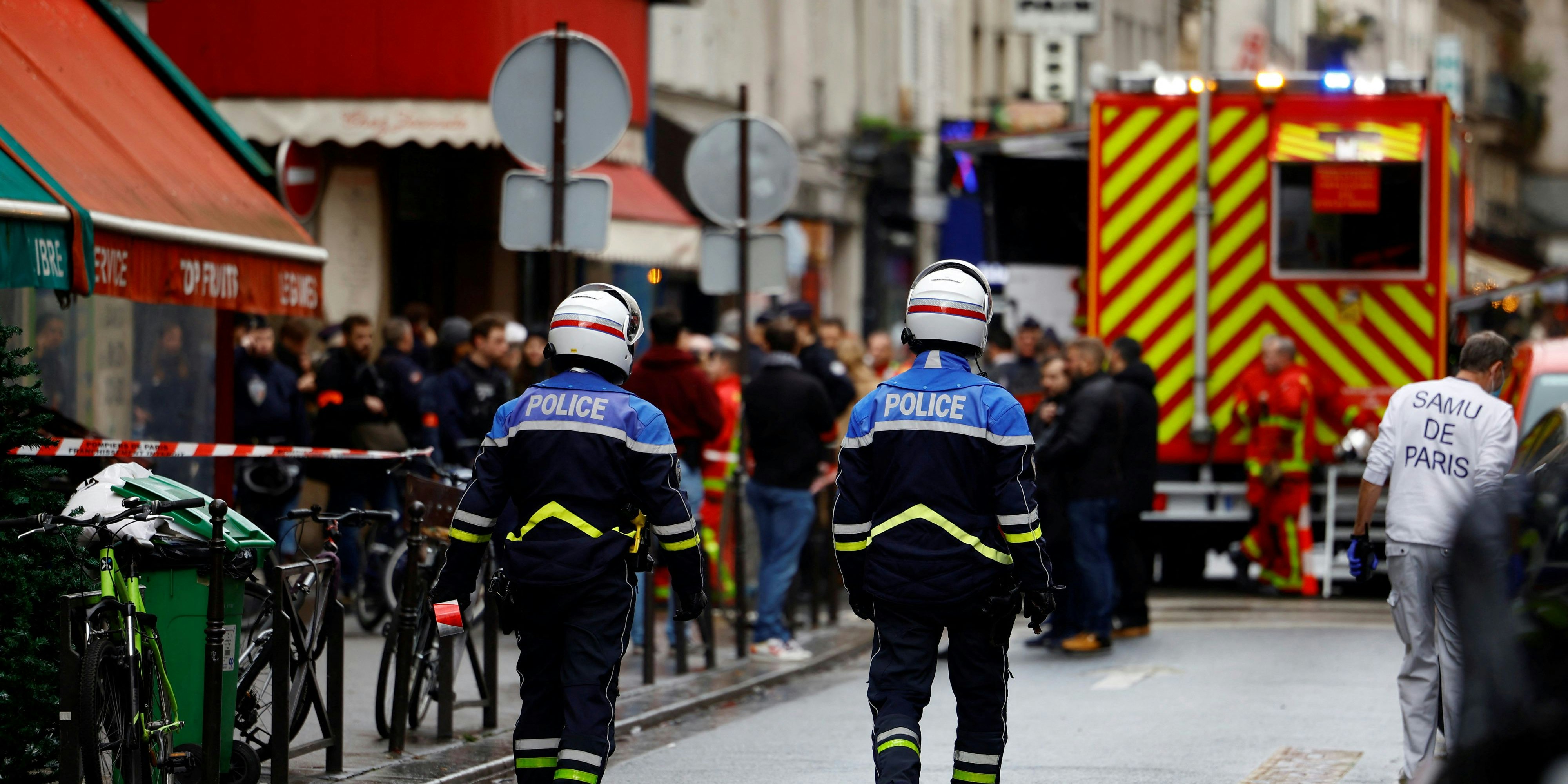 French police an firefighters secure a street after gunshots were fired killing two people and injuring several in a central district of Paris, France, December 23, 2022. REUTERS/Sarah Meyssonnier 