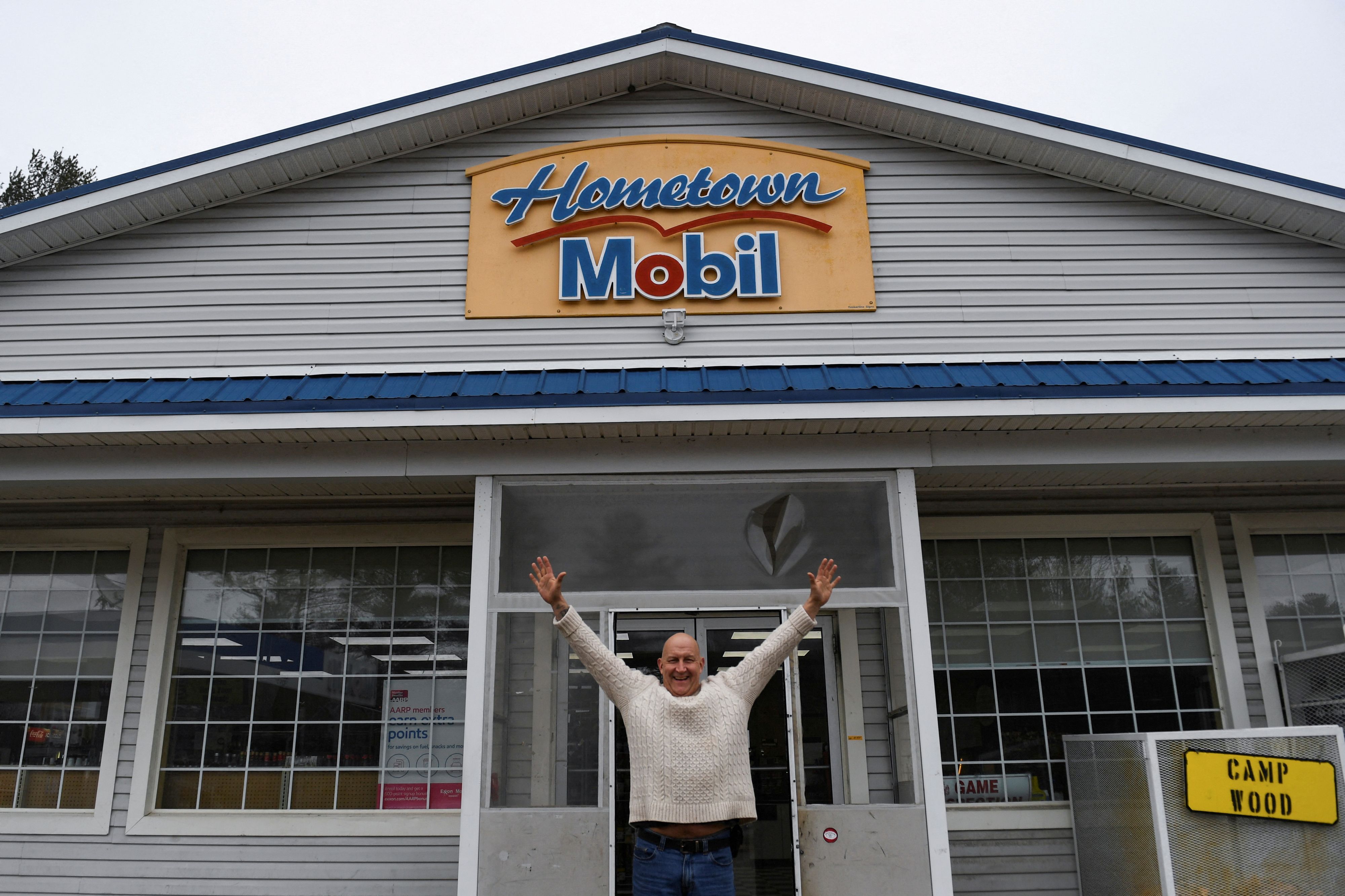 Hometown Gas & Grill owner Fred Cotreau poses for a photo at his store, where a single winning ticket for a Mega Millions lottery jackpot of at least $1.35 billion, the second largest jackpot in U.S. history, was sold, according to lottery organizers, in Lebanon, Maine, U.S. January 14, 2023.  REUTERS/Amanda Sabga
