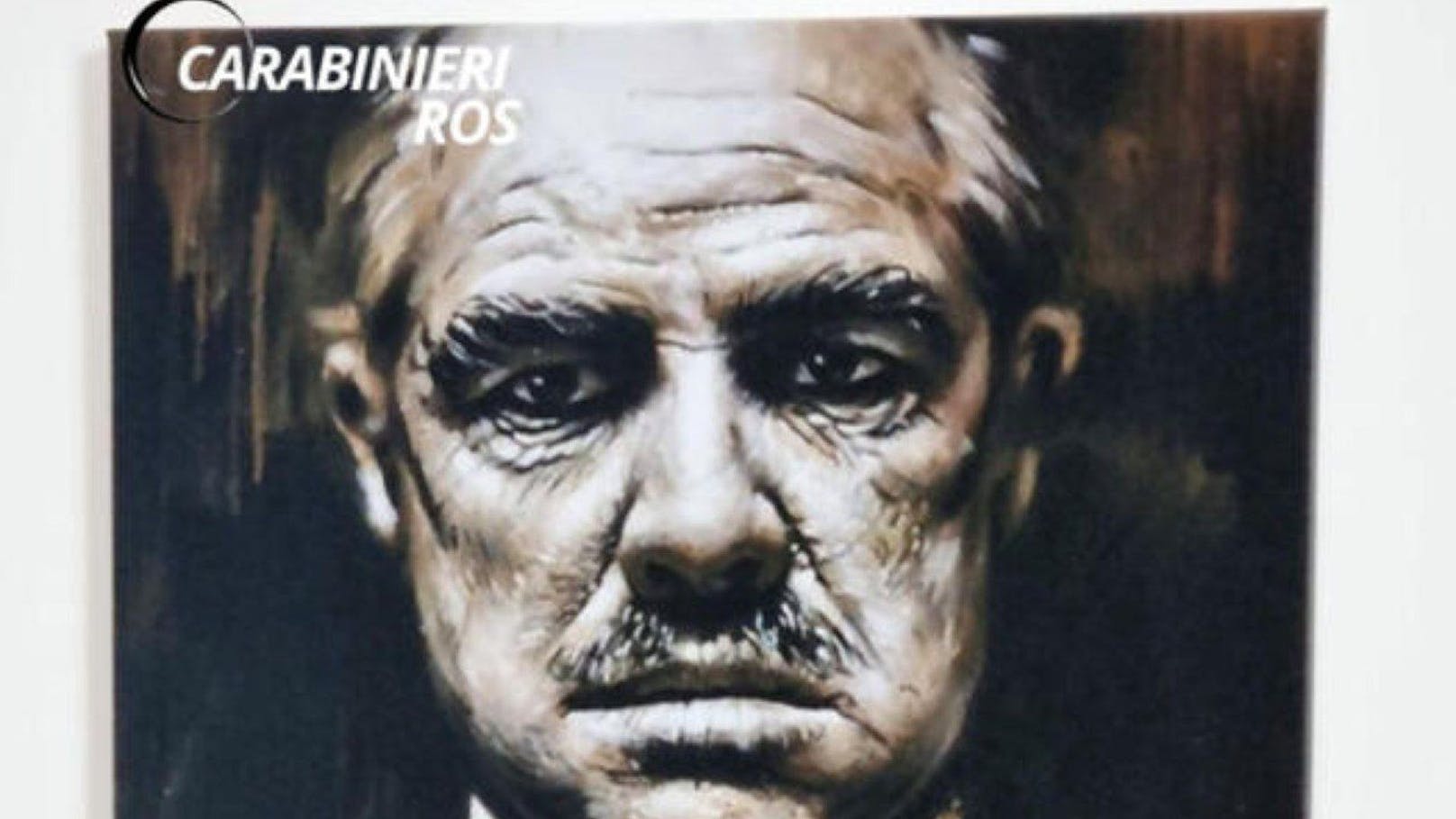 Ein Poster von Marlo Brando als "Der Pate" prangt von den Wänden des Mafioso-Verstecks.