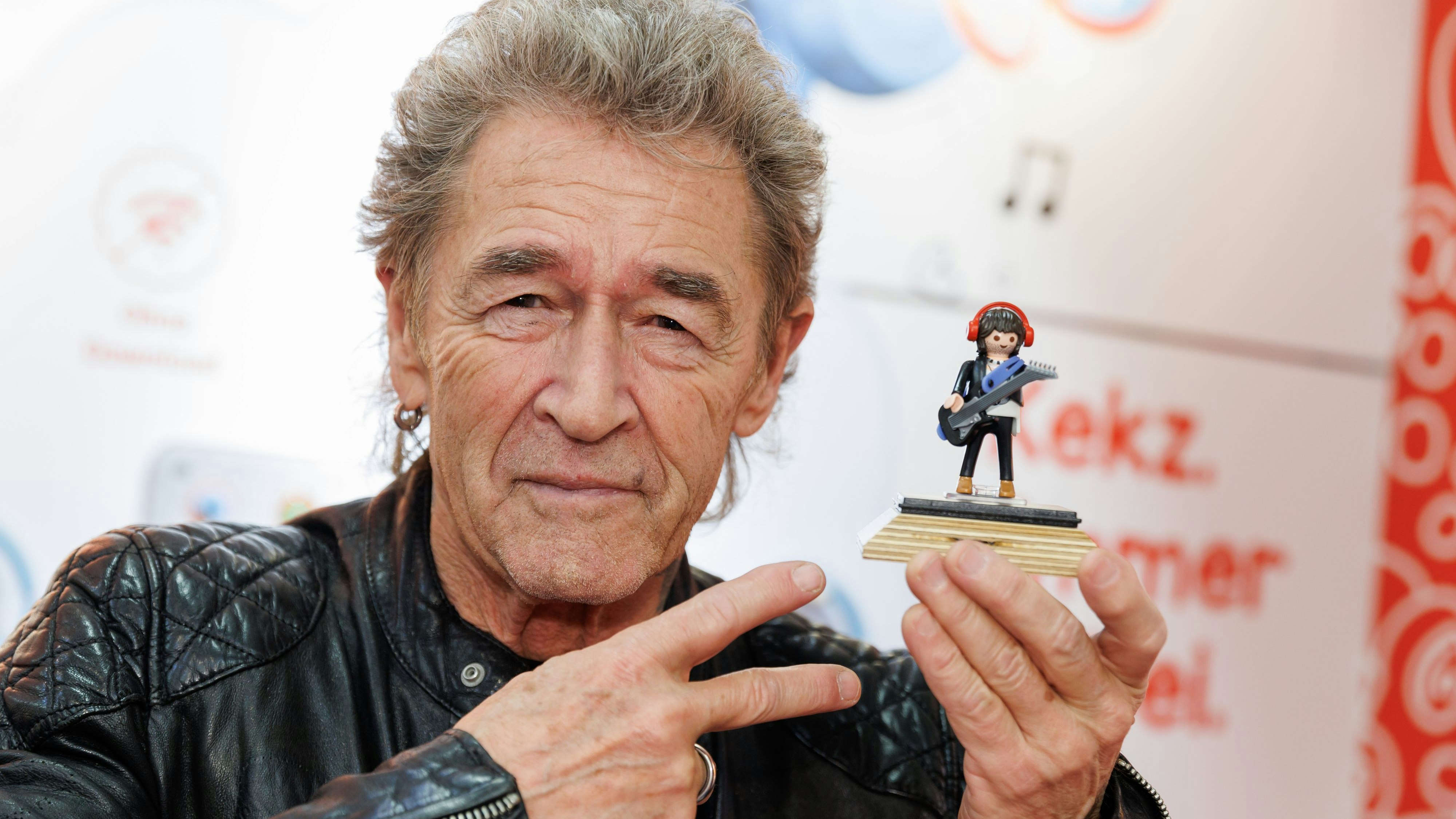 Download von www.picturedesk.com am 31.01.2023 (15:42).  31 January 2023, Bavaria, Nuremberg: Peter Maffay, musician, holds a figurine with his likeness in his hand at the Playmobil stand on the sidelines of the Spielwarenmesse novelty show. The 72nd Spielwarenmesse runs from February 1 to 5, 2023. Photo: Daniel Karmann/dpa - 20230131_PD2075 - Rechteinfo: Rights Managed (RM)