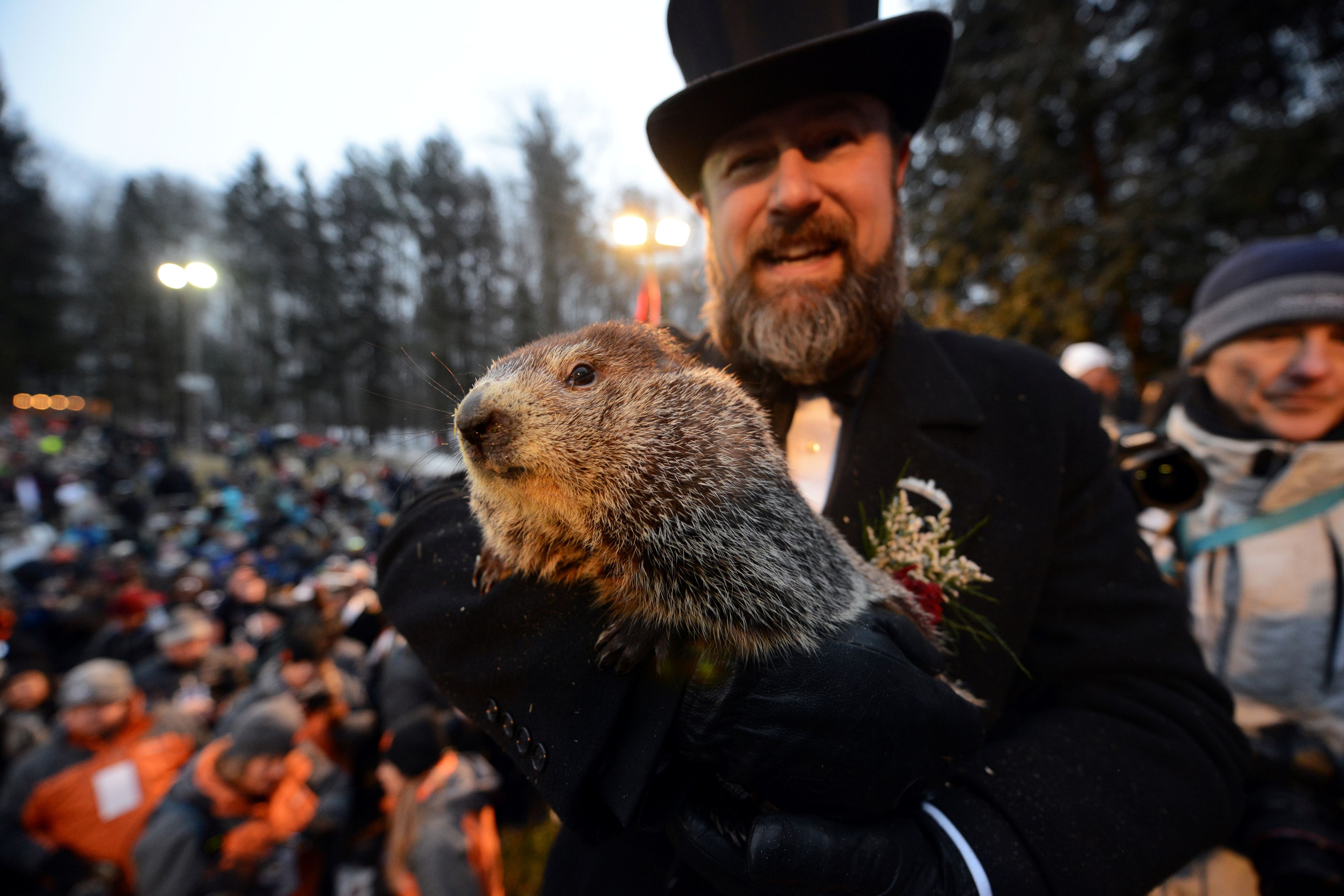 Punxsutawney Phil's co-handler AJ Dereume holds the famous groundhog on the 133rd Groundhog Day in Punxsutawney, Pennsylvania, U.S., February 2, 2019. REUTERS/Alan Freed