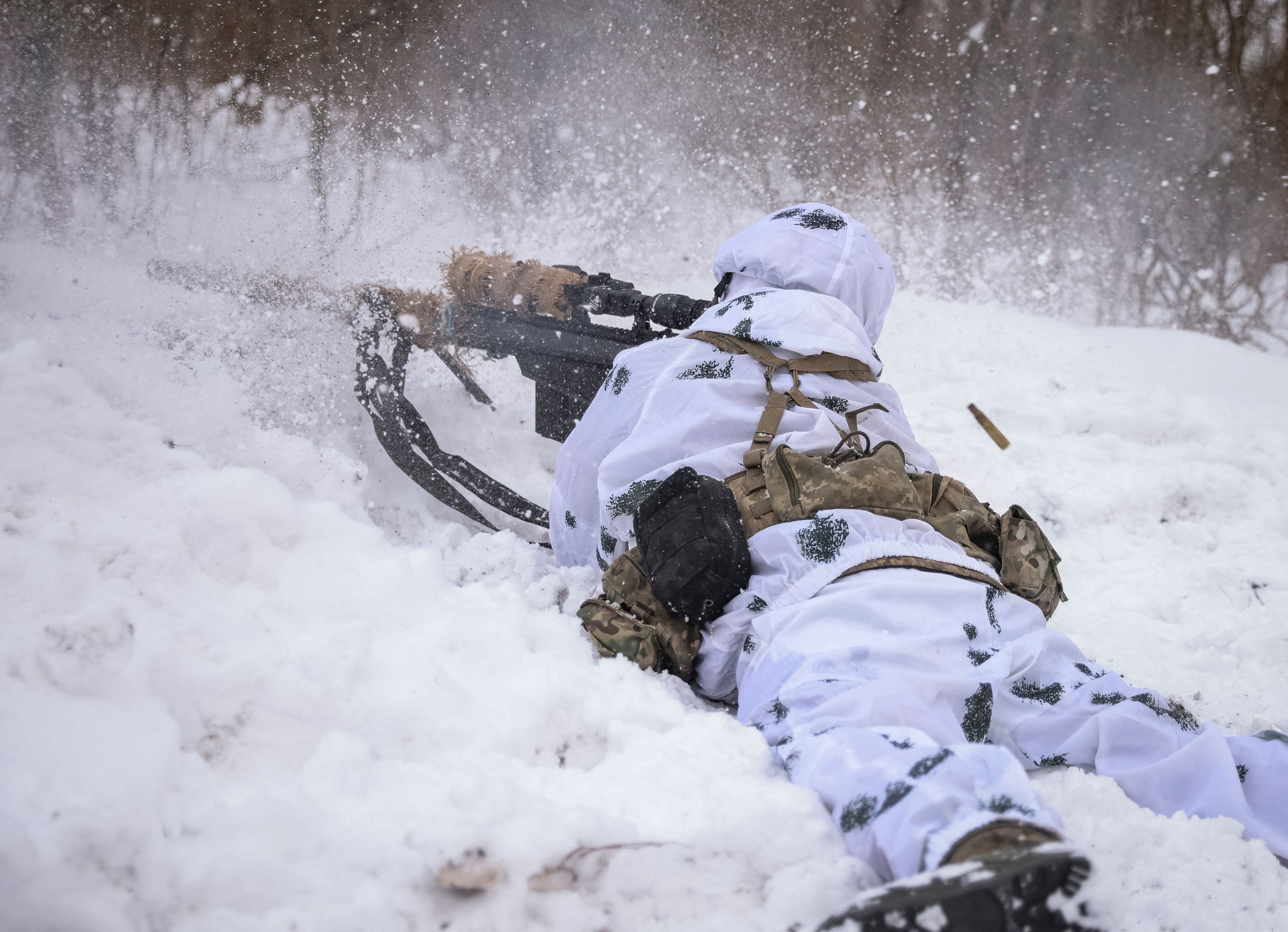 A Ukrainian sniper fires from his position, as Russia's attack on Ukraine continues, in the front line city of Bakhmut, Ukraine February 17, 2023. REUTERS/Yevhen Titov