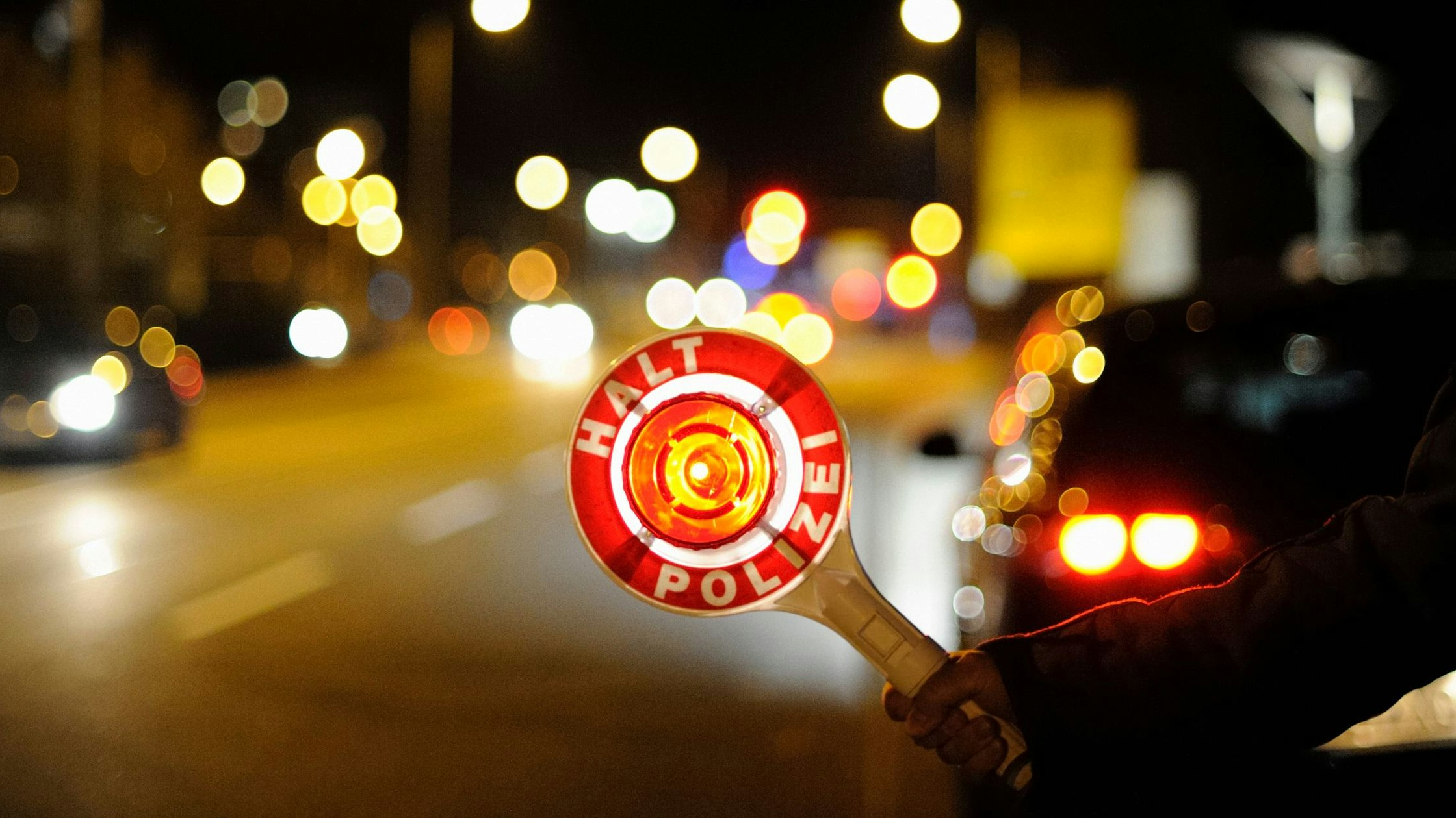 German police officer at traffic control point.