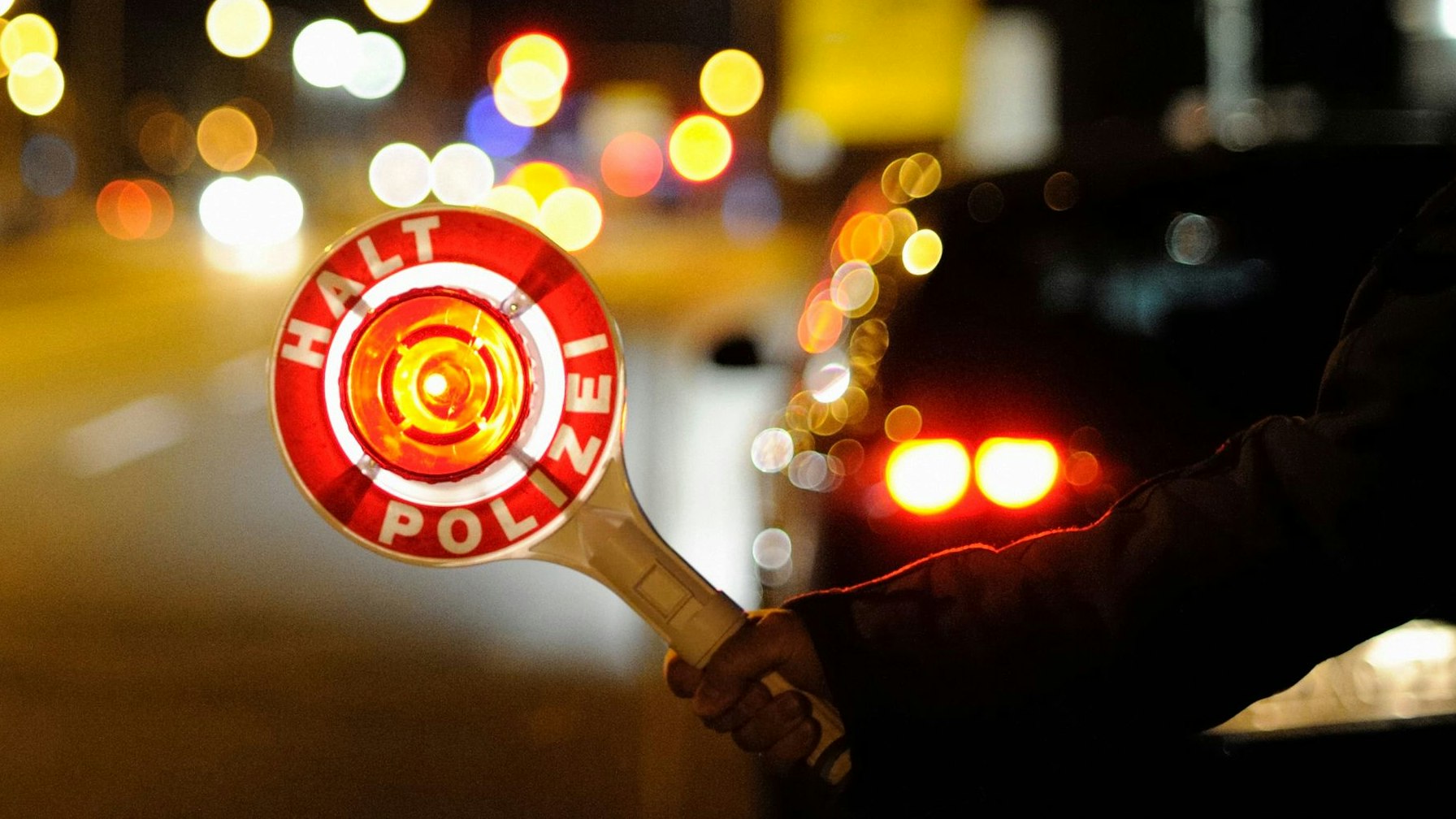 German police officer at traffic control point.