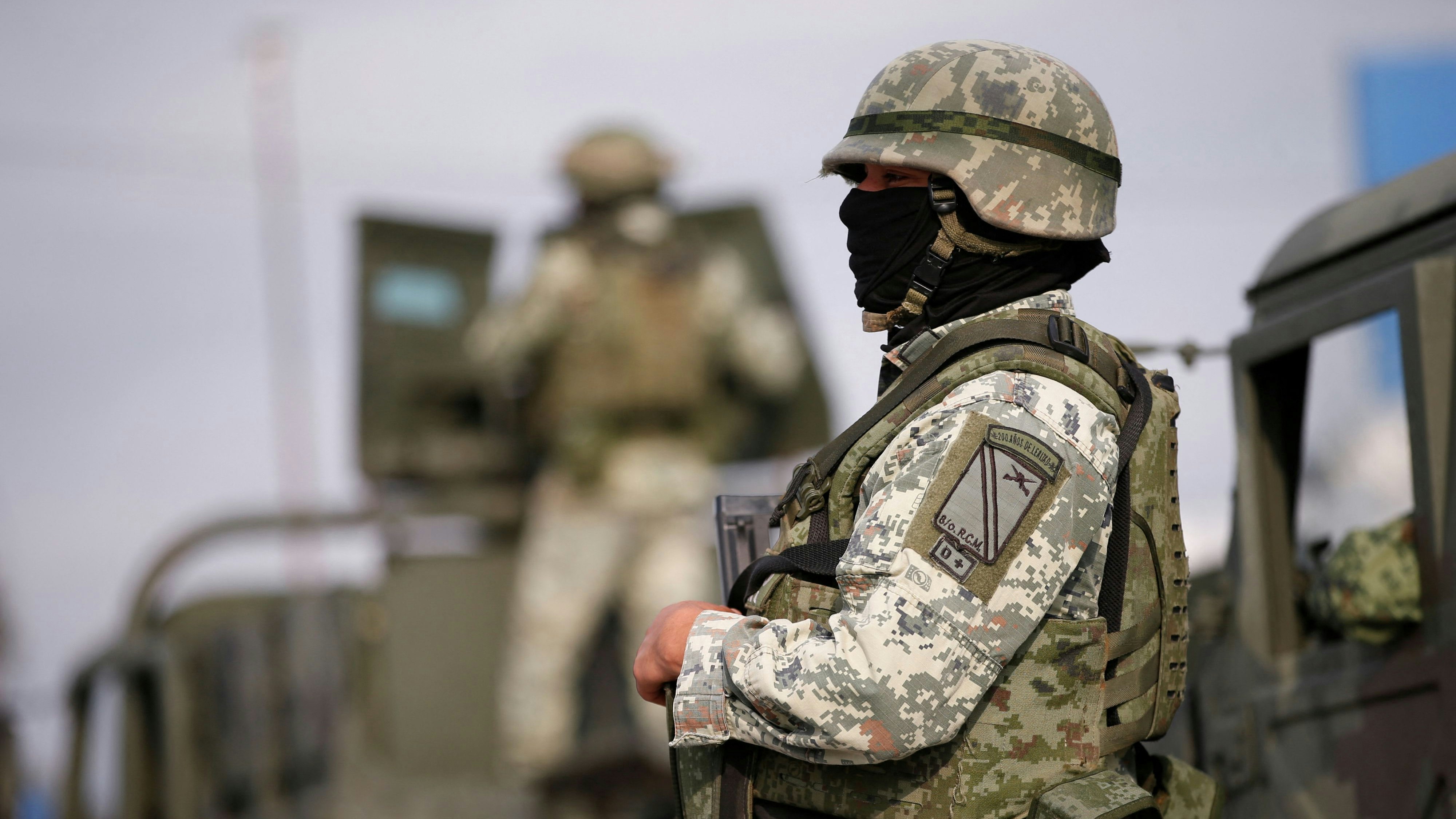 Soldiers stand guard outside the Forensic Medical Service morgue building ahead of the transfer of the bodies of two of four Americans kidnapped by gunmen to the U.S. border, in Matamoros, Mexico, March 9, 2023. REUTERS/Daniel Becerril