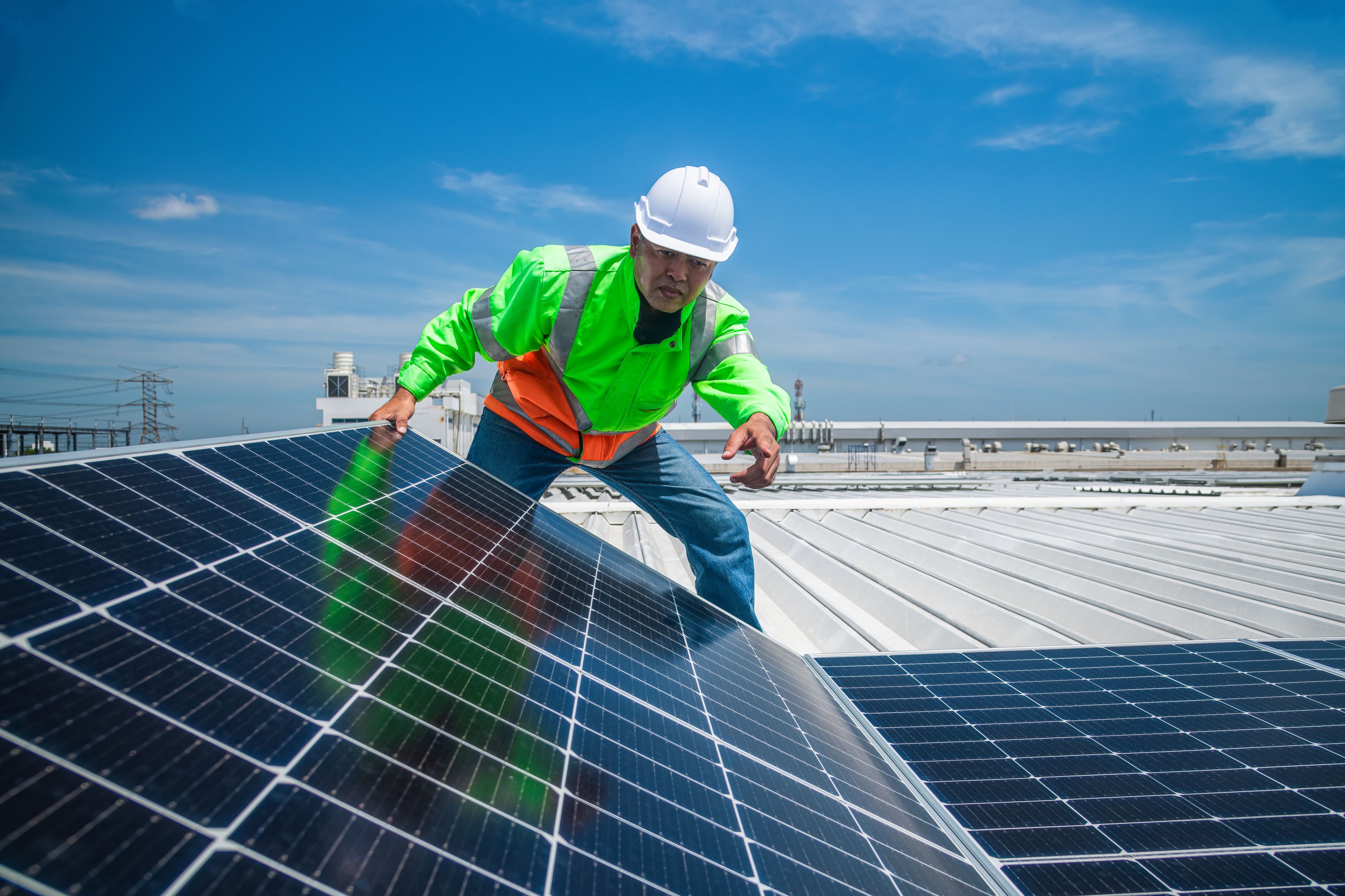 Engineer wearing unifrom and helmet inspect and check solar cell panel ,solar cell is ecology energy sunlight power installation for industrail ,alternative environment power concept.