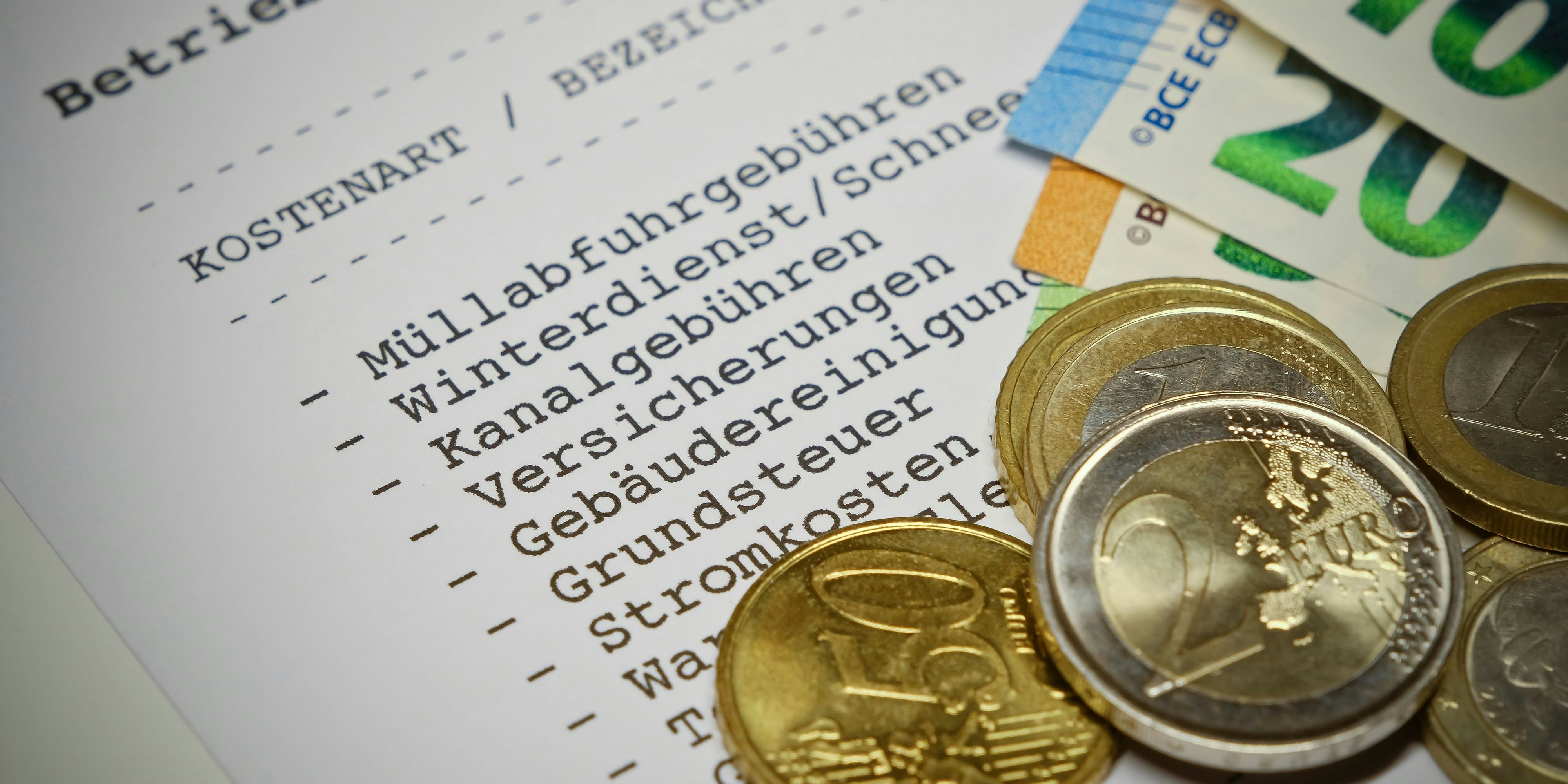 Betriebskostenabrechnung (german language) - Statement of operating costs with Euro coins and Euro banknotes. Information: The statement has been designed and printed by myself. No problems with copyright.