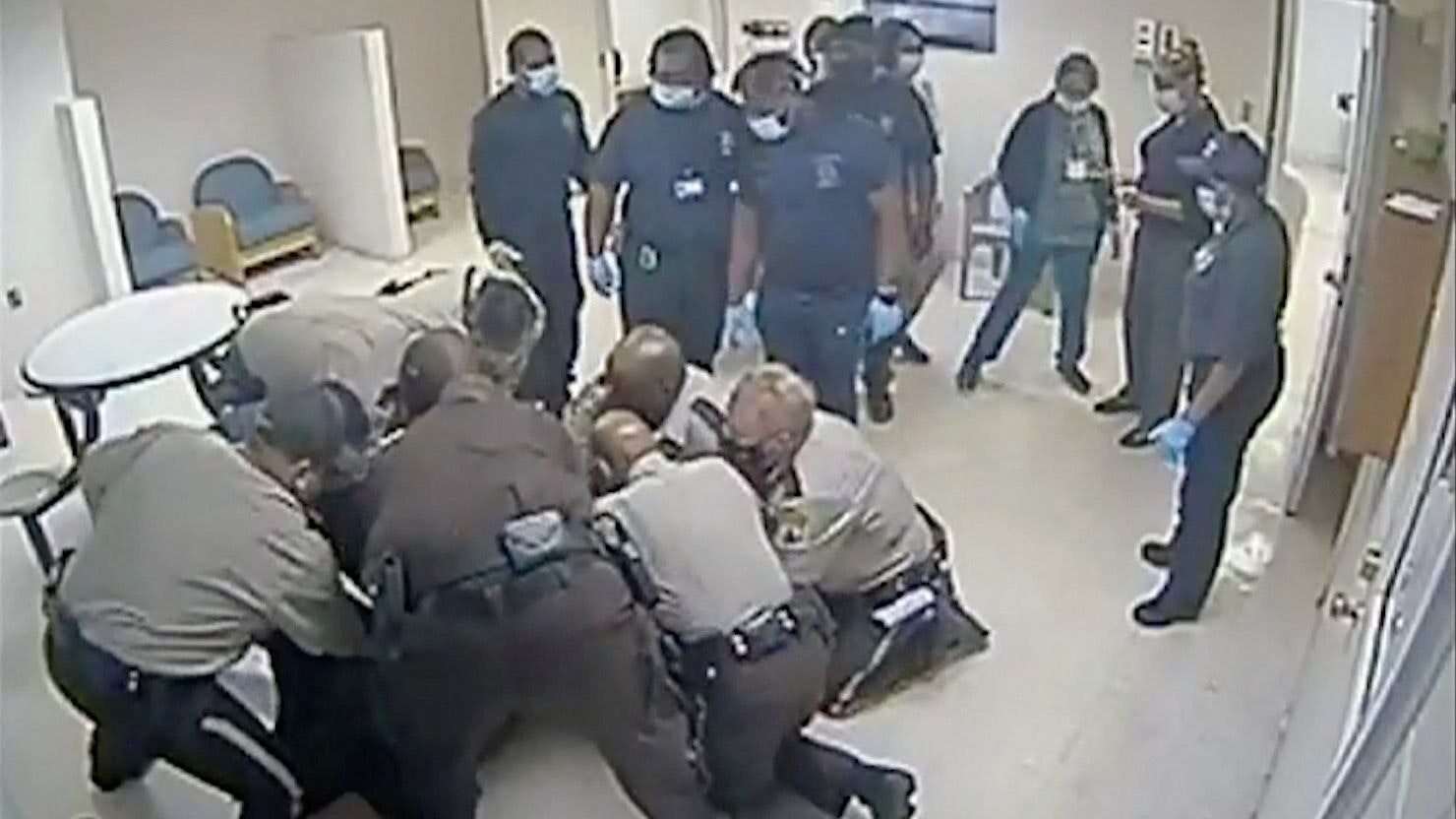 Virginia sheriff deputies wrestle with Irvo Otieno, a 28-year-old Black man, at a state mental hospital before he died, in a still image from video surveillance at Central State Hospital in Petersburg, Virginia, U.S. March 6, 2023.  Dinwiddie County Commonwealth Attorney's Office/Handout via REUTERS  THIS IMAGE HAS BEEN SUPPLIED BY A THIRD PARTY.