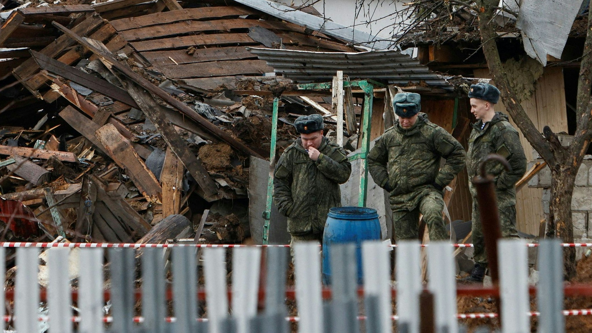 Service members inspect the accident scene following what Russia's Defence Ministry said to be the explosion of a halted Ukrainian unmanned aerial vehicles (UAV) in the town of Kireyevsk in the Tula region, Russia, March 27, 2023. REUTERS/REUTERS PHOTOGRAPHER     TPX IMAGES OF THE DAY     