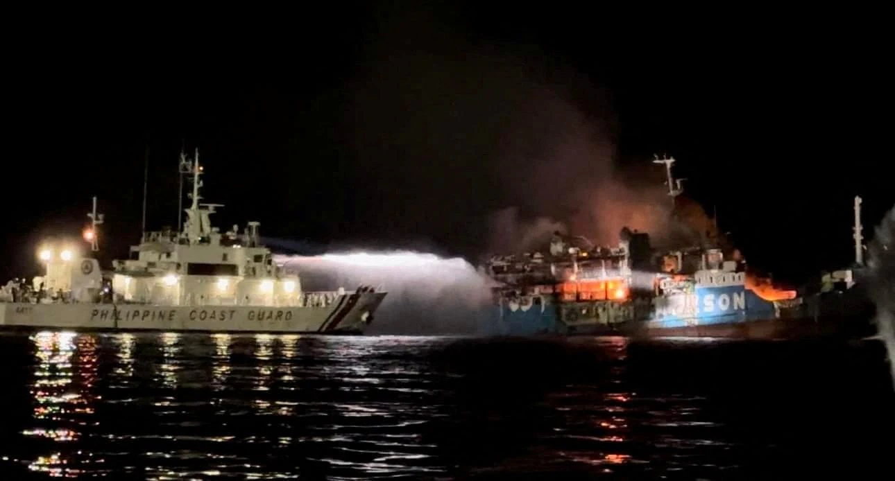 Philippine Coast Guard respond to the fire incident onboard M/V LADY MARY JOY 3 at the waters off Baluk-Baluk Island, Hadji Muhtamad, Basilan, Philippines, March 29, 2023. Philippine Coast Guard/Handout via REUTERS    THIS IMAGE HAS BEEN SUPPLIED BY A THIRD PARTY. NO RESALES. NO ARCHIVES.