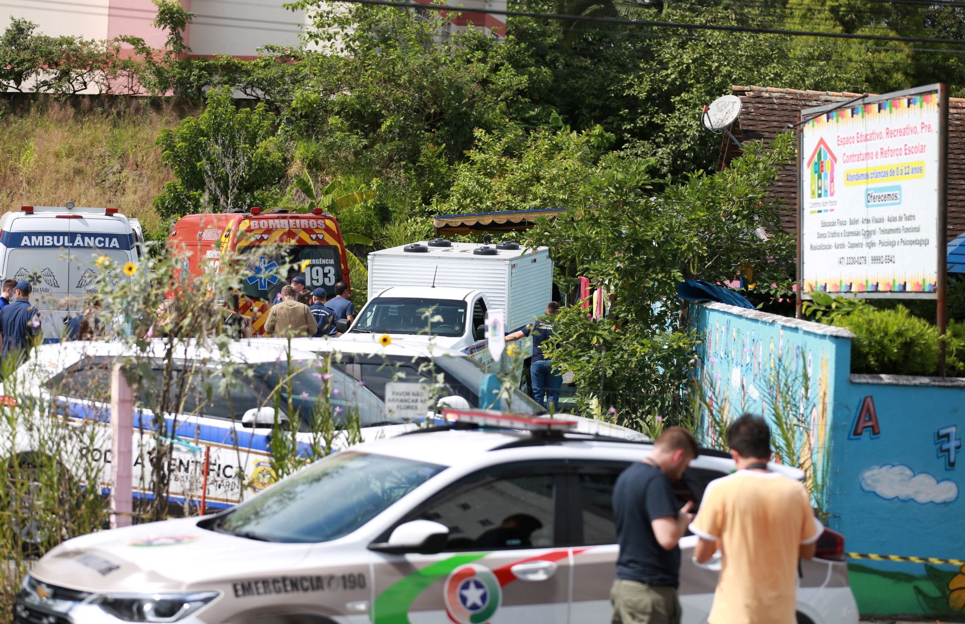 A view shows forensic technicians, ambulances and policemen outside a pre-school after a 25-year-old man attacked children, killing several and injuring others, according to local police and hospital, in Blumenau, in the southern Brazilian state of Santa Catarina, Brazil April 5, 2023. REUTERS/Denner Ovidio NO RESALES. NO ARCHIVES