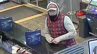 Nach einem Überfall auf ein Wettbüro sucht die Polizei diesen Mann.